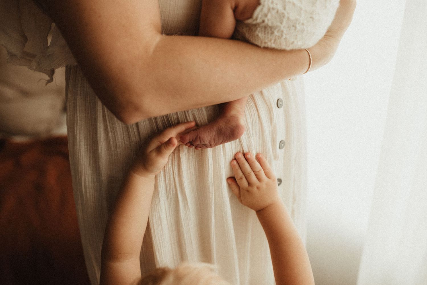 Gentle family moments captured in soft, dreamy natural light.