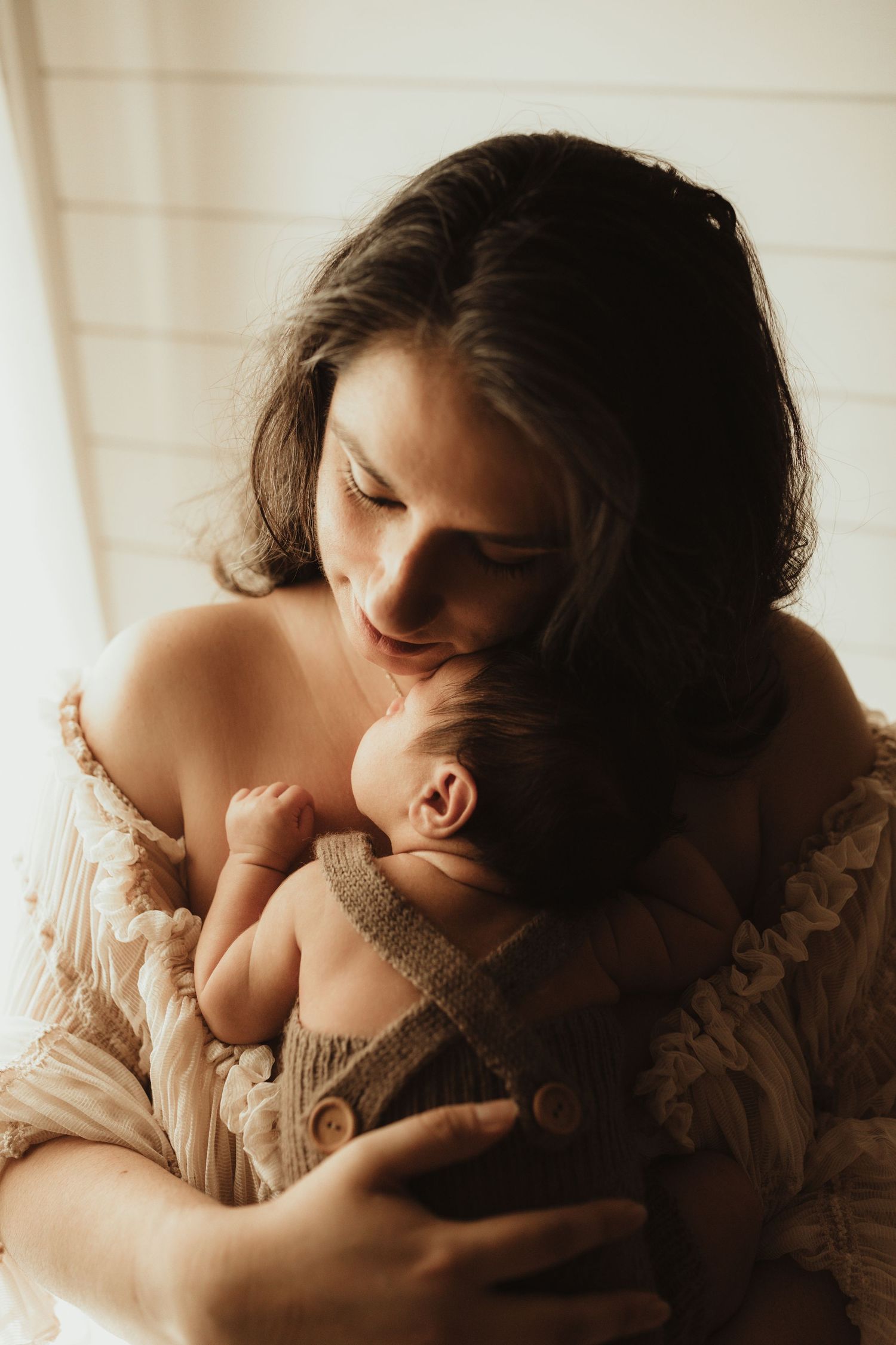 A romantic sepia-toned photo series showing intimate moments between a couple in soft lighting.