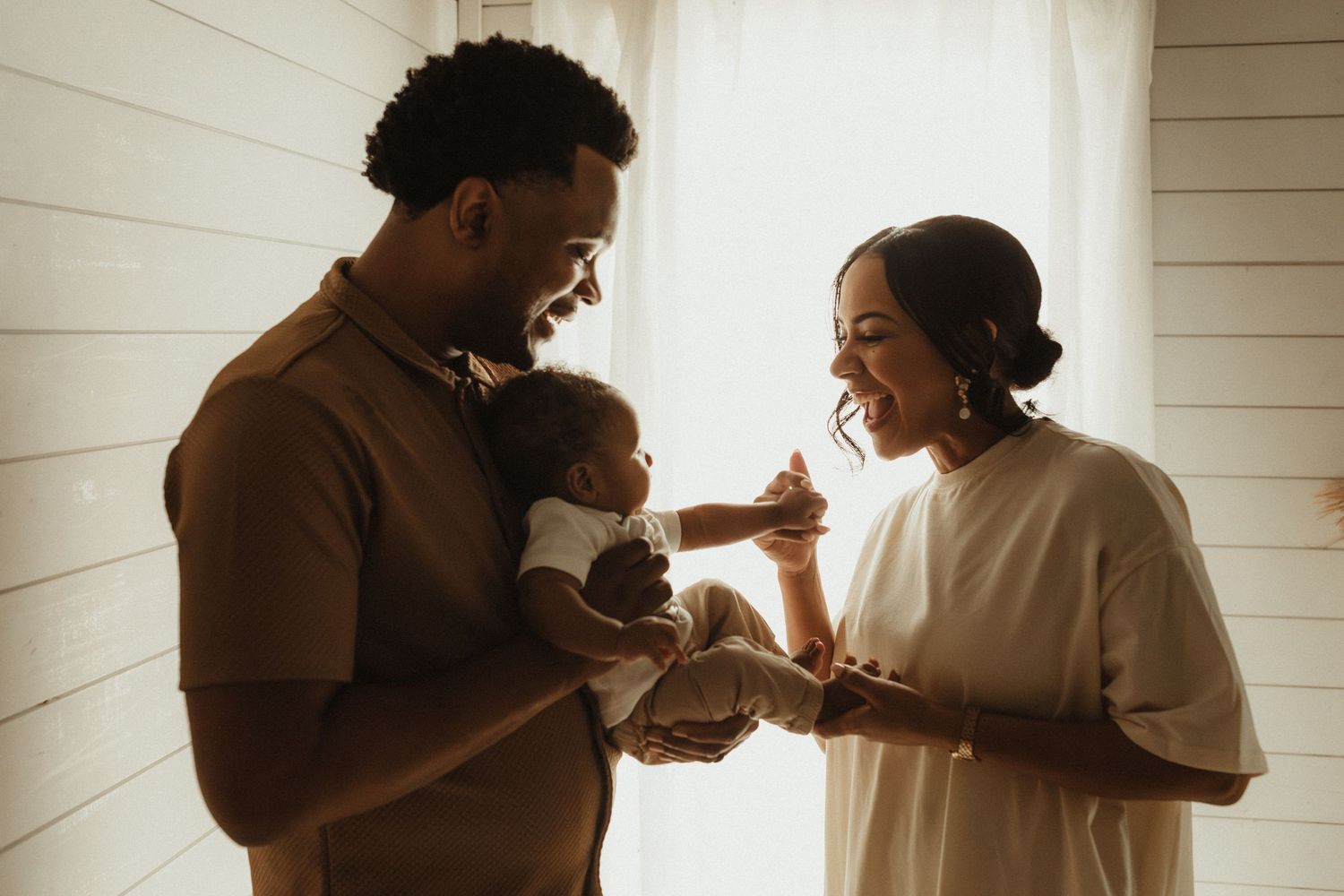 A romantic silhouette sequence shows a couple sharing tender moments against a sunlit window backdrop.