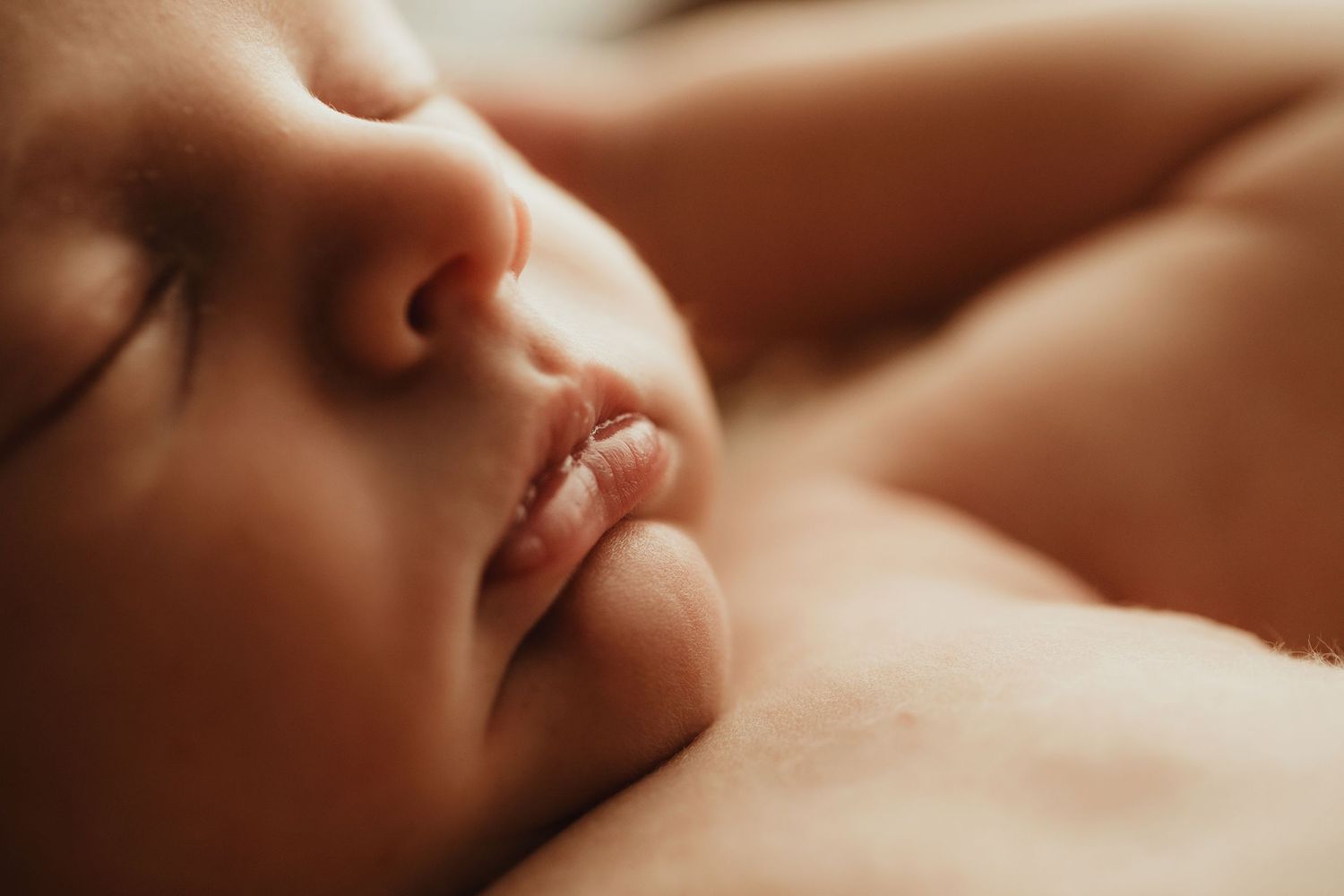 Extreme close up macro shot of a sleeping baby's mouth and nose.