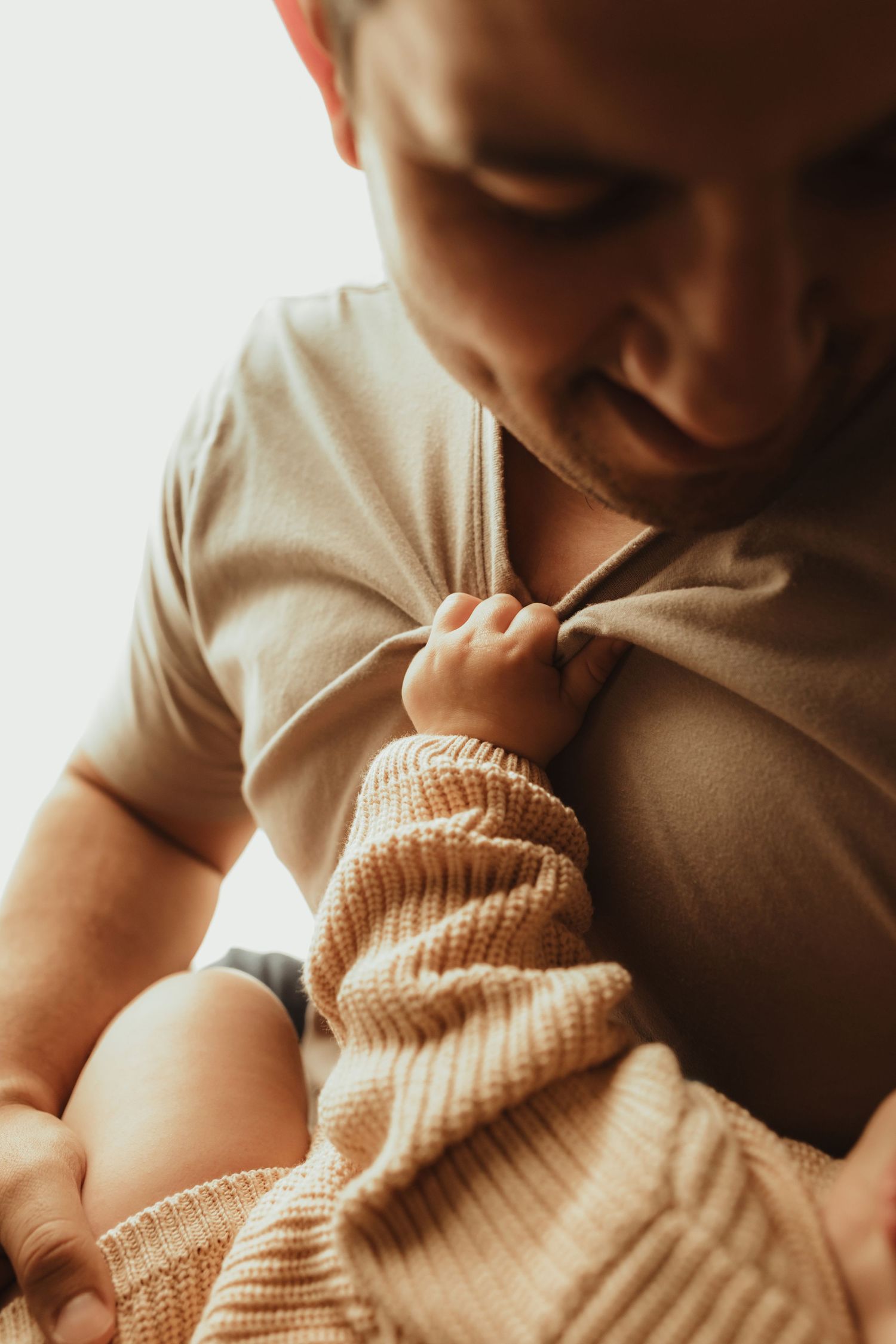 Close-up collage of tender parent-baby moments showing gentle nurturing and bonding in warm lighting.