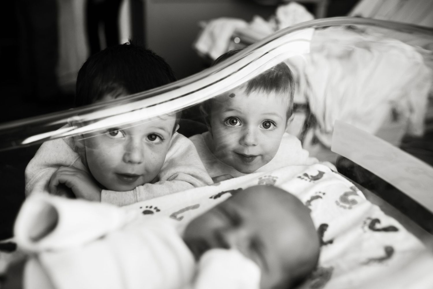 A black and white photo collage shows children looking down at books in a classroom or library setting.