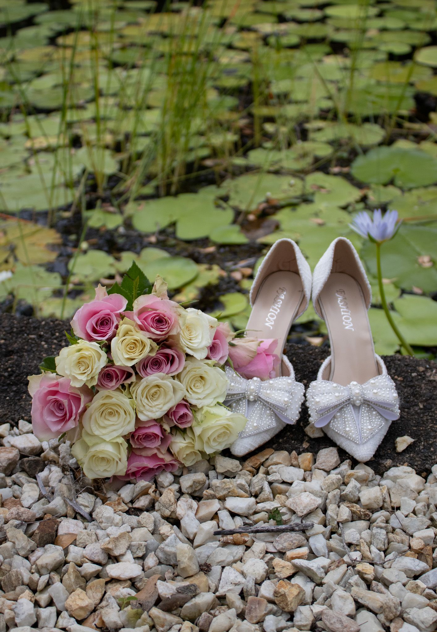 Up close photo of wedding shoes and her bouquet.