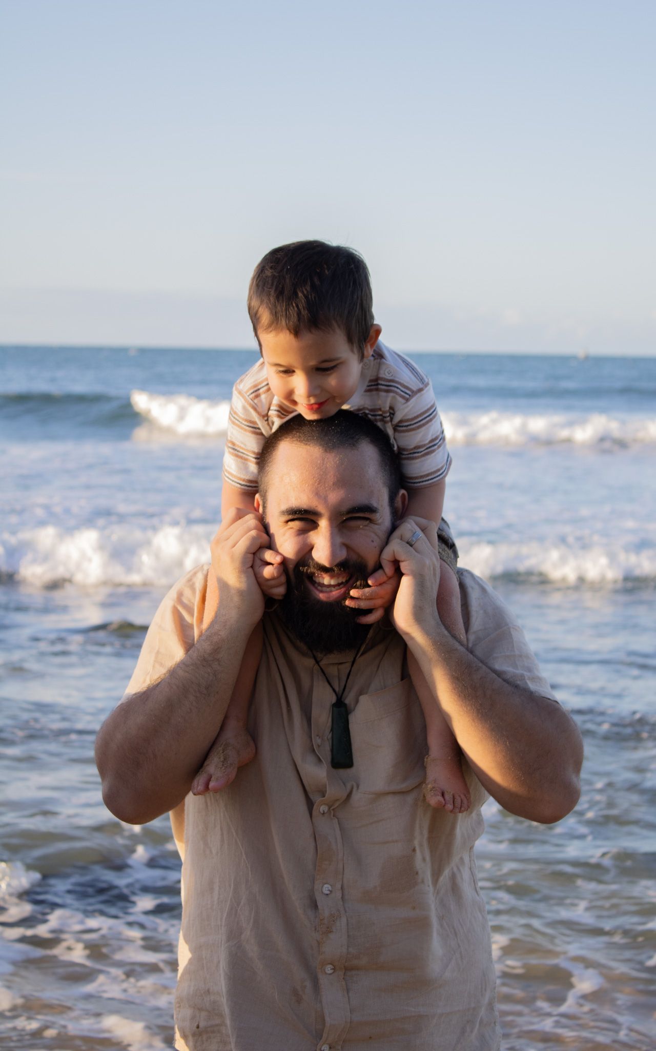 A dad and his son playing together.
