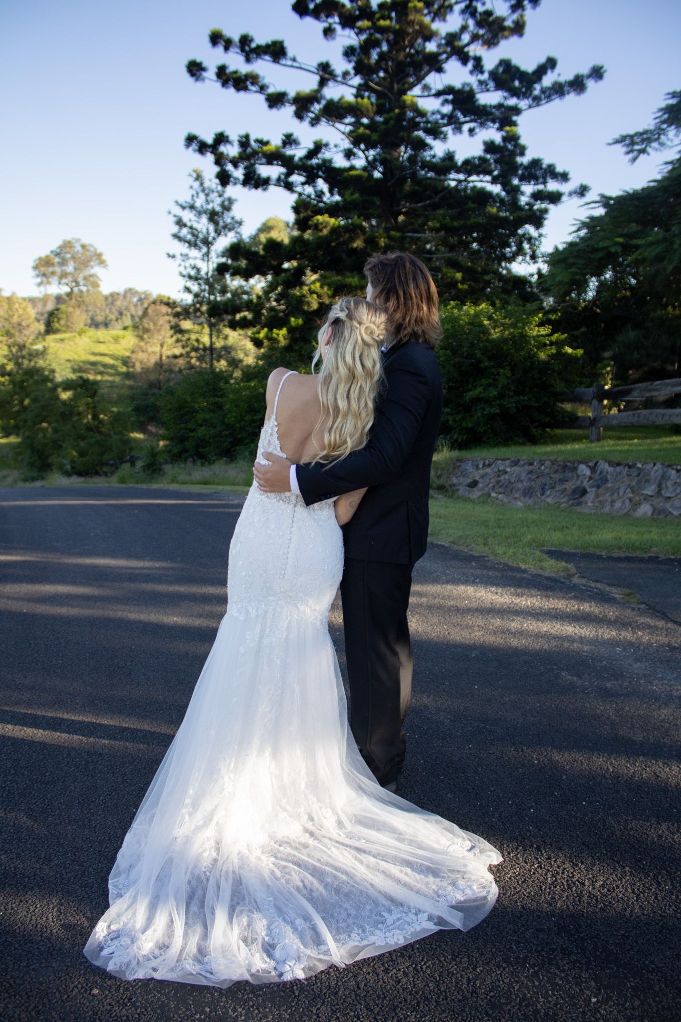 A married couple getting their wedding photos done.