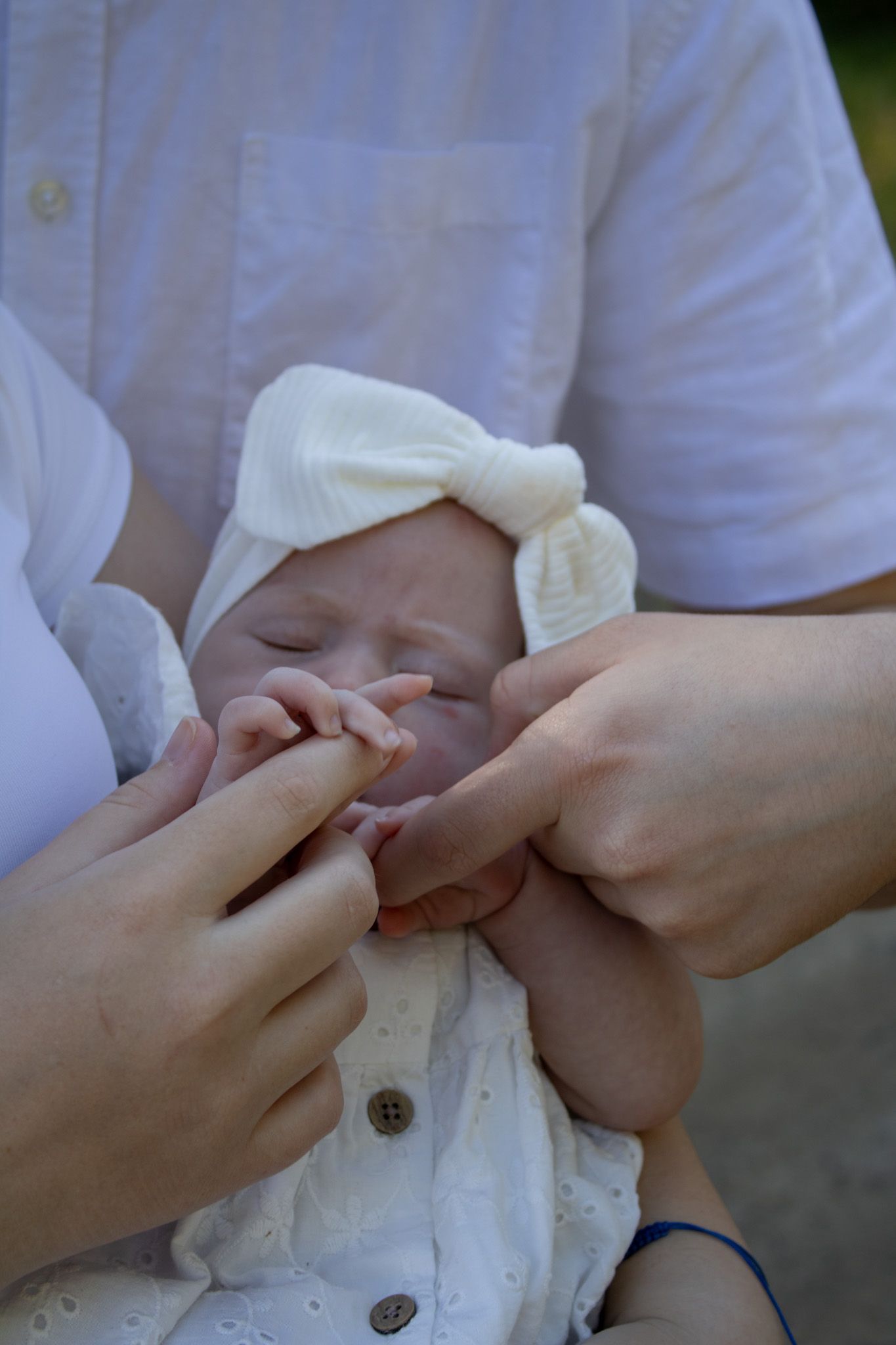 A family getting photos with their newborn.