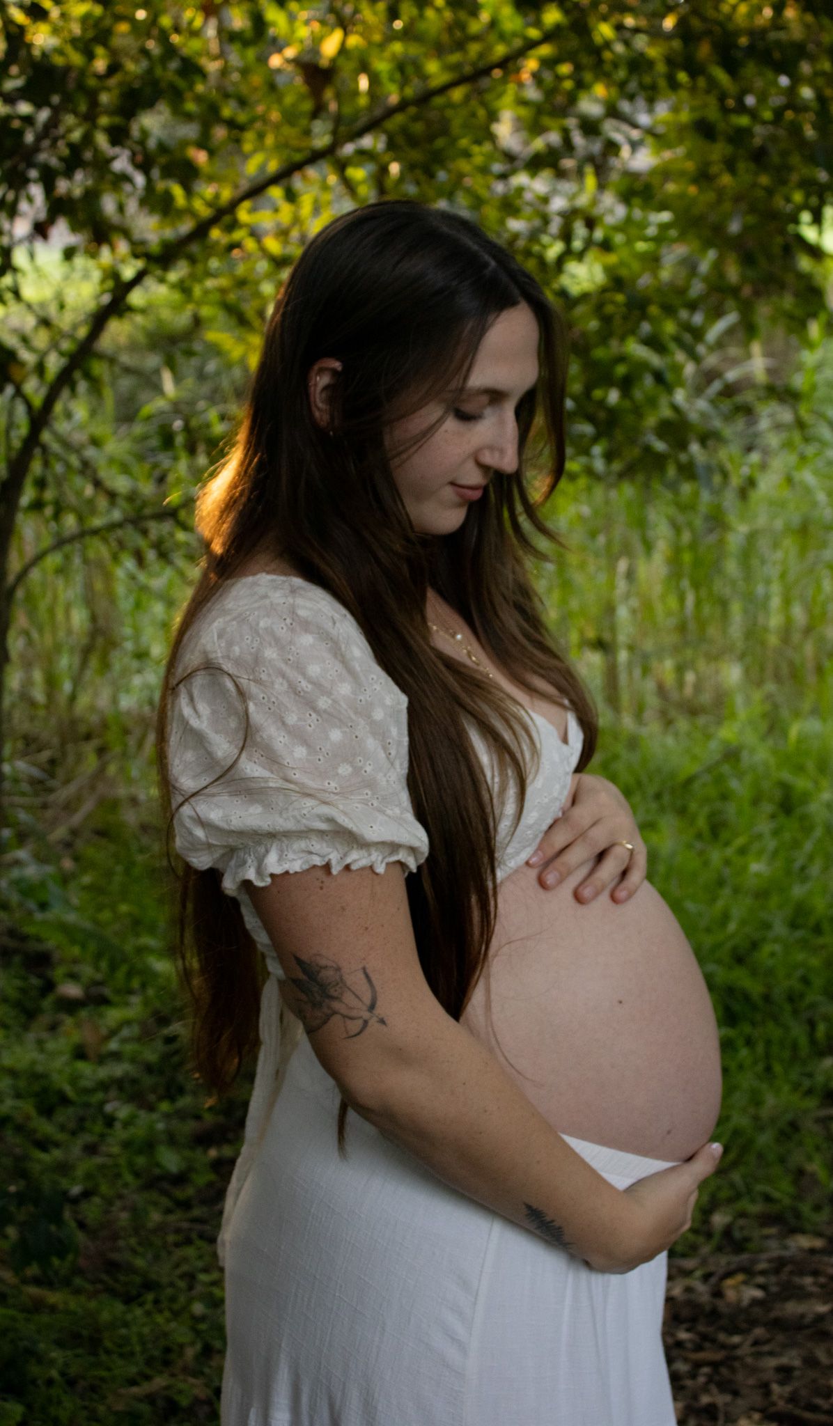 Maternity photos in a forest.