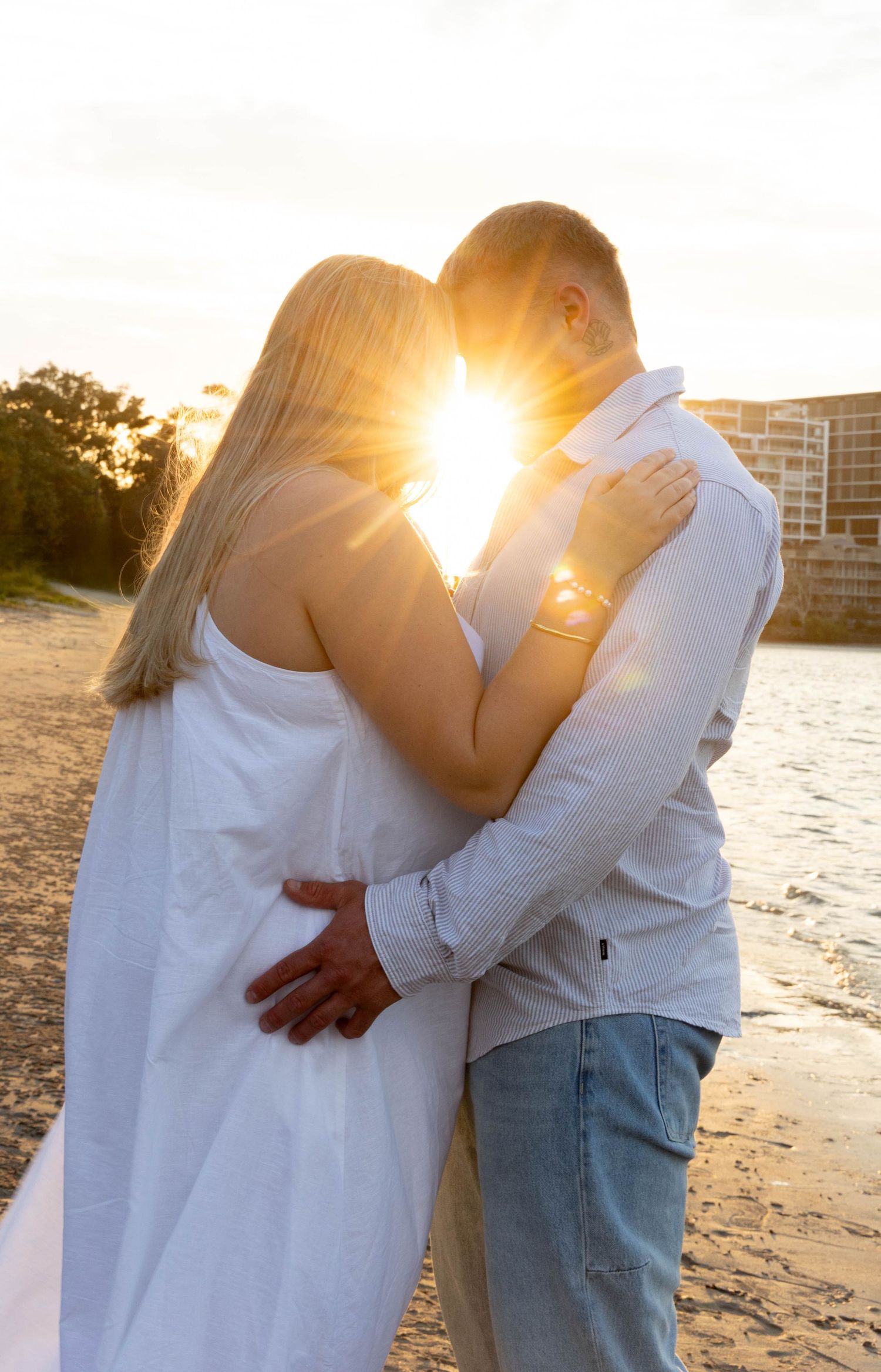 Engagement photos at the beach at sunset.