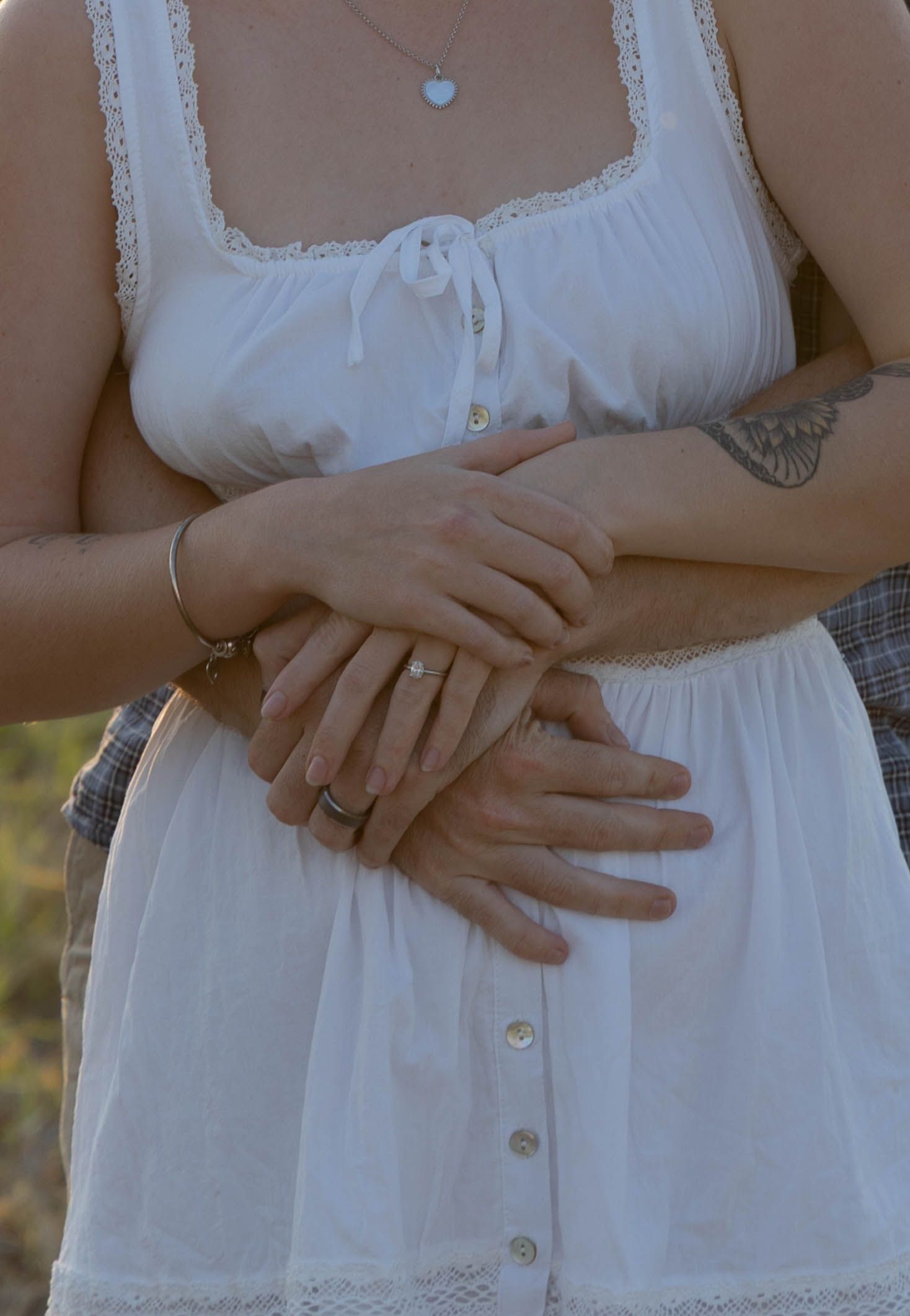 Engagement photos in a field.