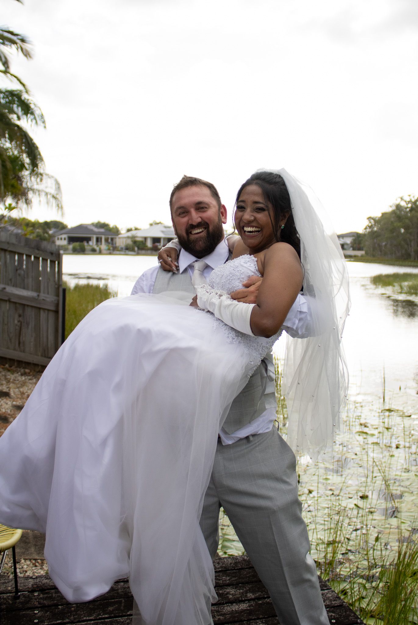 Couple being fun getting their wedding photos.