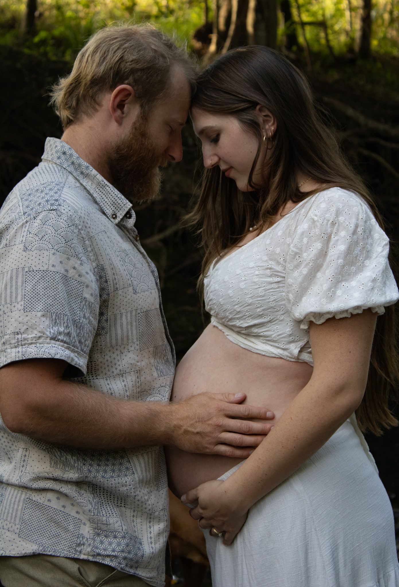 Maternity photos in a forest.