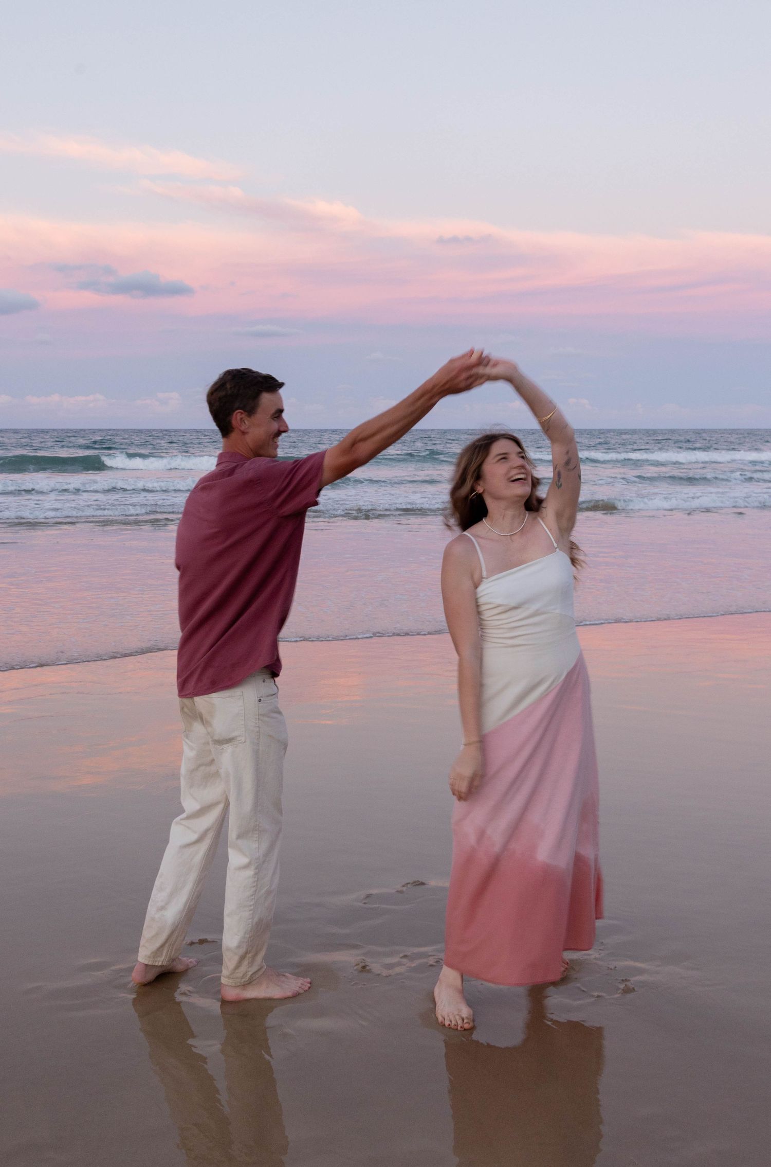 Engagement photos at the beach at sunset.
