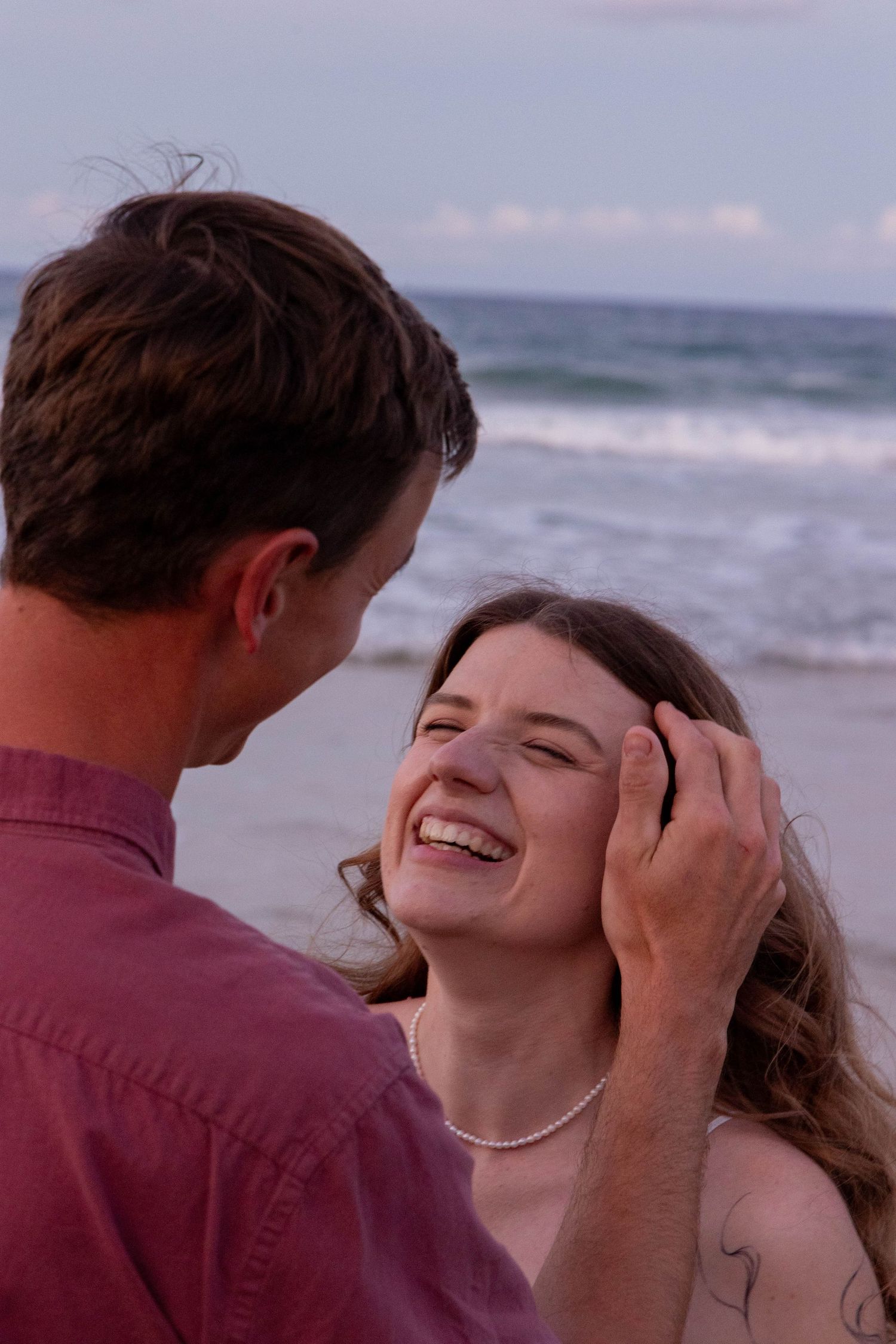Engagement photos at the beach at sunset.