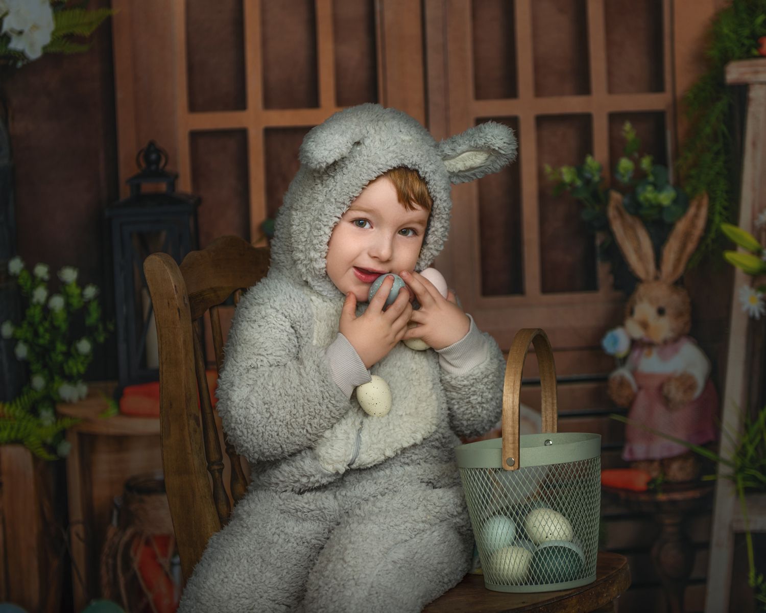 Child in bunny costume plays in vintage-styled indoor setting.