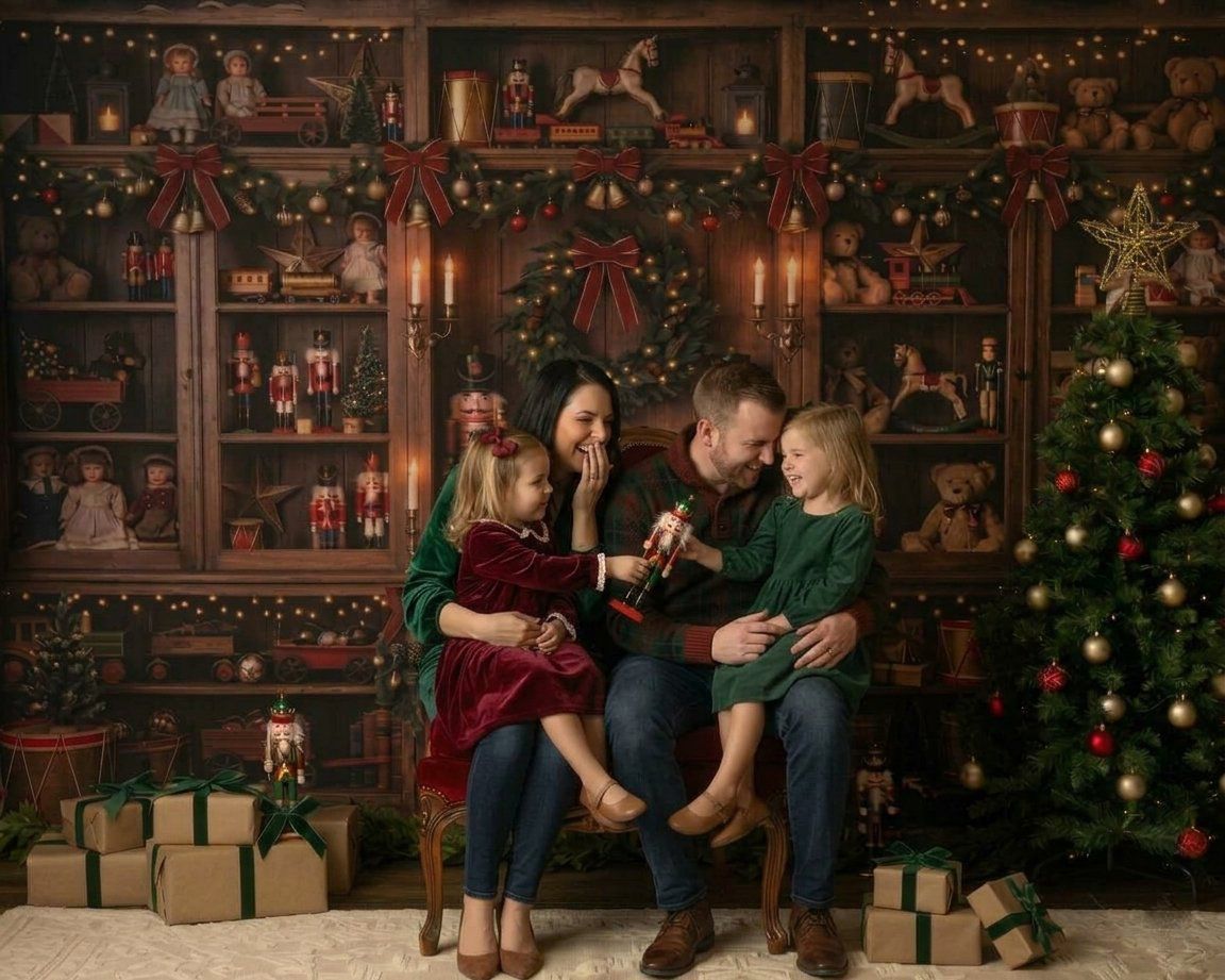 Family of four sharing a joyful Christmas moment on a bench surrounded by festive decorations and wrapped gifts.