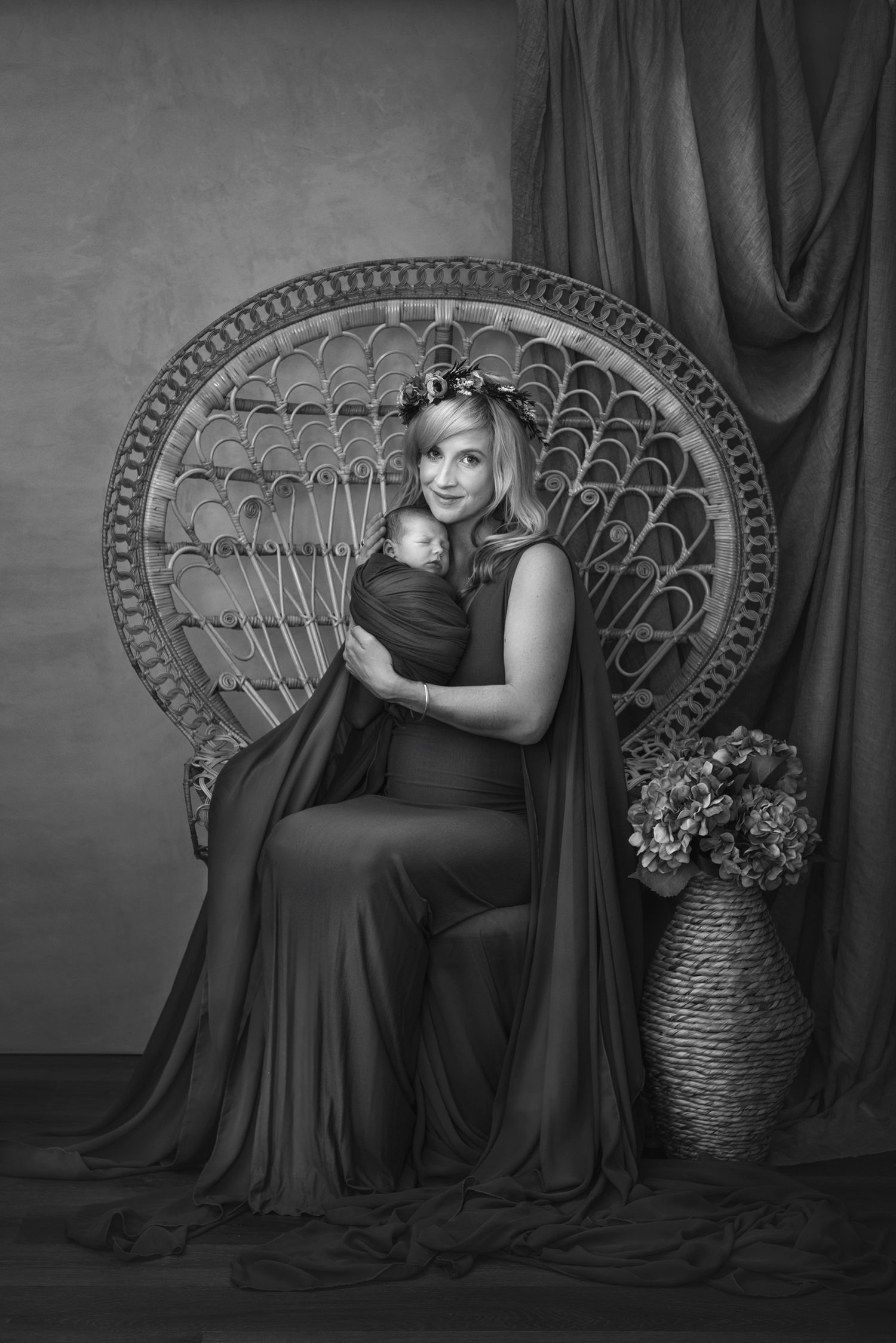 Black and white portrait series with ornate peacock chair and flowing fabric backdrop.