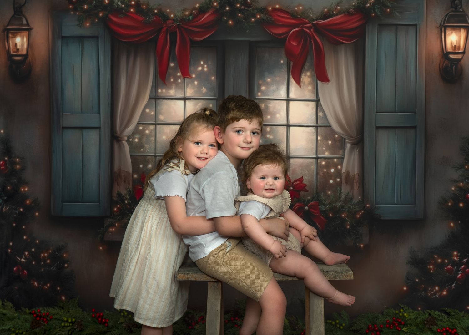 Children pose together in front of a festive holiday backdrop with teal shutters, garland, and red bows.
