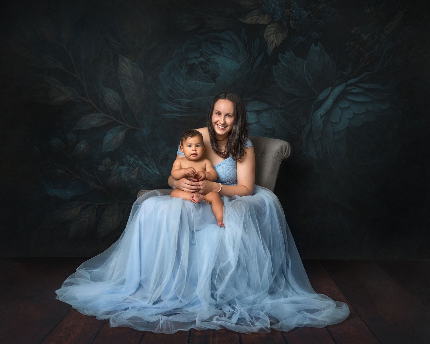 Ethereal studio portraits in soft blue tones creating a dreamy atmosphere.