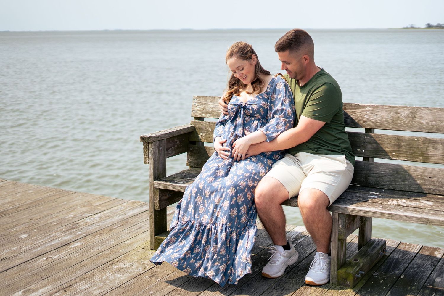 couple on bench at a pier