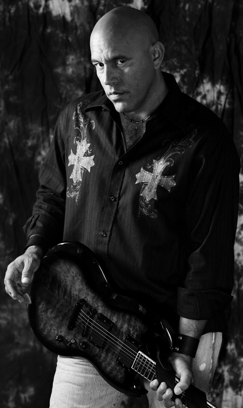 Dramatic black and white series featuring musician with guitar.