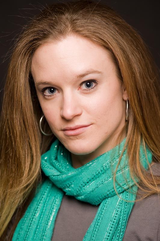 Portrait series showing playful expressions while wearing a bright turquoise scarf.