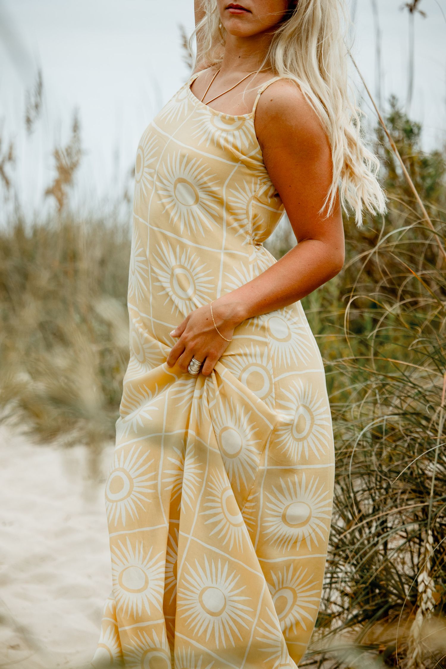 Female beach portrait in yellow dress among sand dunes, Outer Banks lifestyle photography session