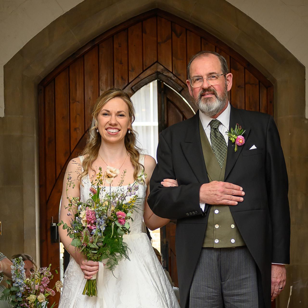 Father of the bride standing beside his daughter moments before walking her down the aisle at St Botolph's Church in central London.