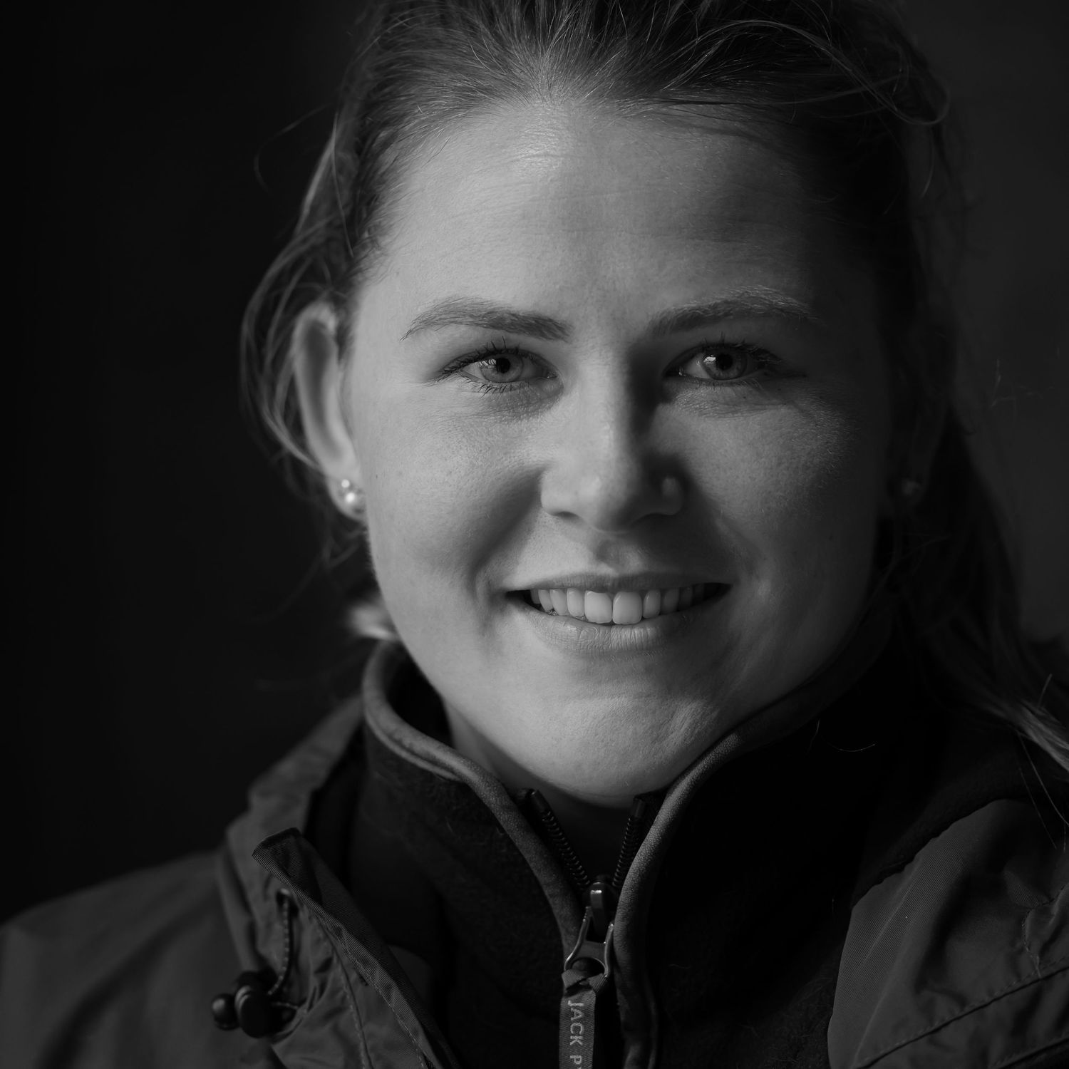 black and white portrait of one of the beaters, taken in a barn during a lunch break of a game shoot