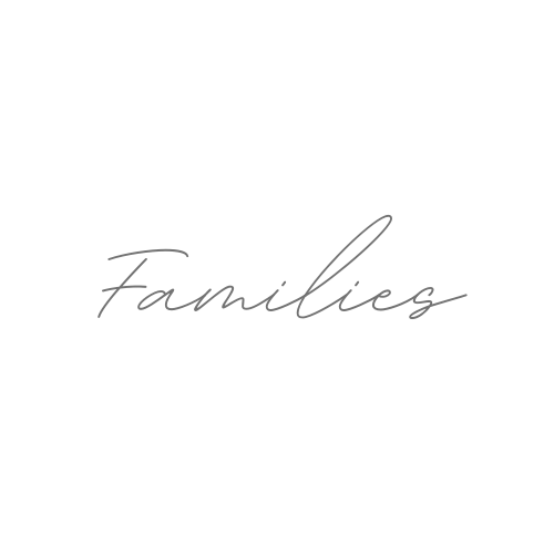Elegant cursive text reading 'Families' in light gray handwriting against white background.