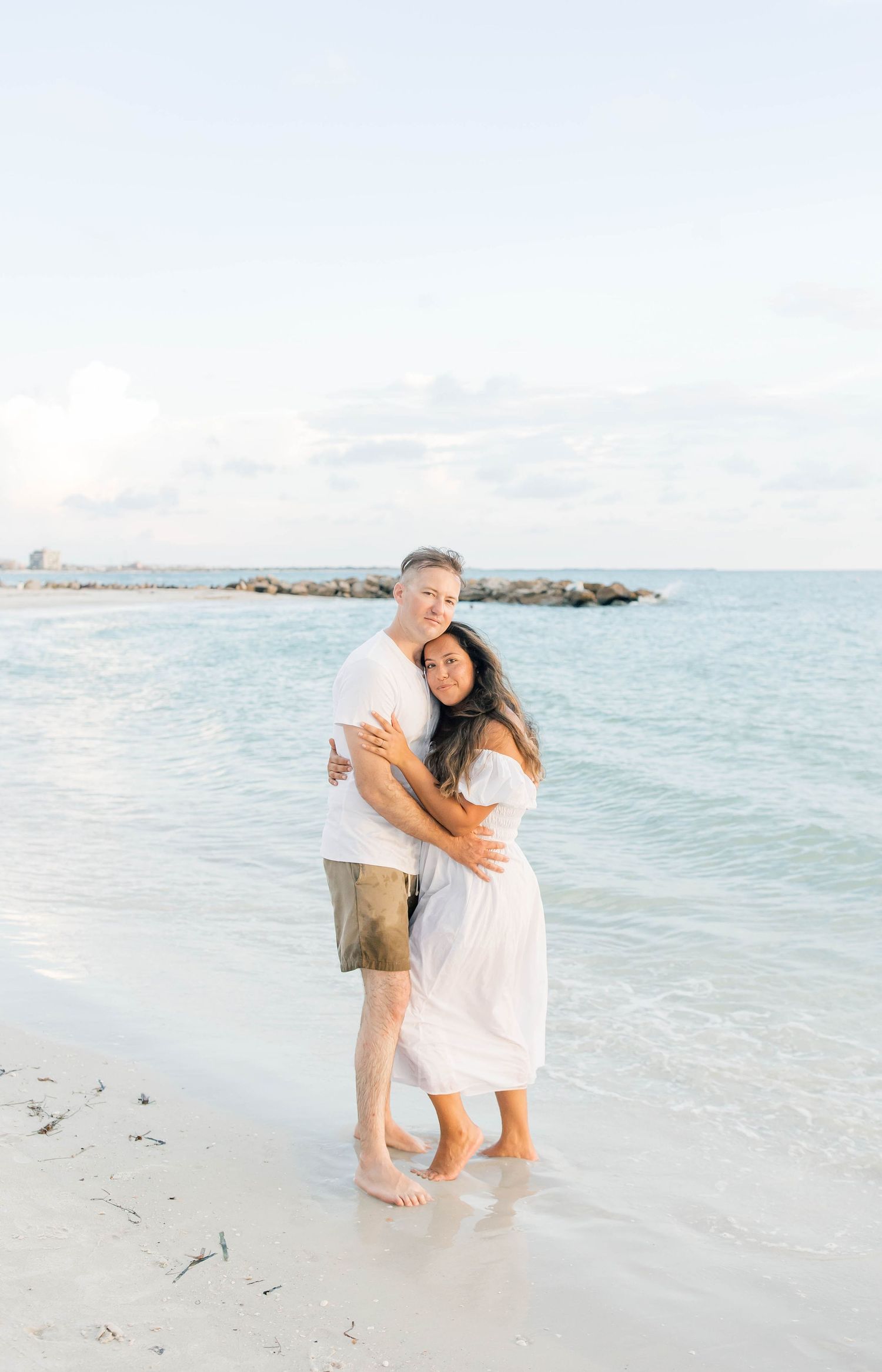 Intimate family moments captured on a pristine white sandy beach.