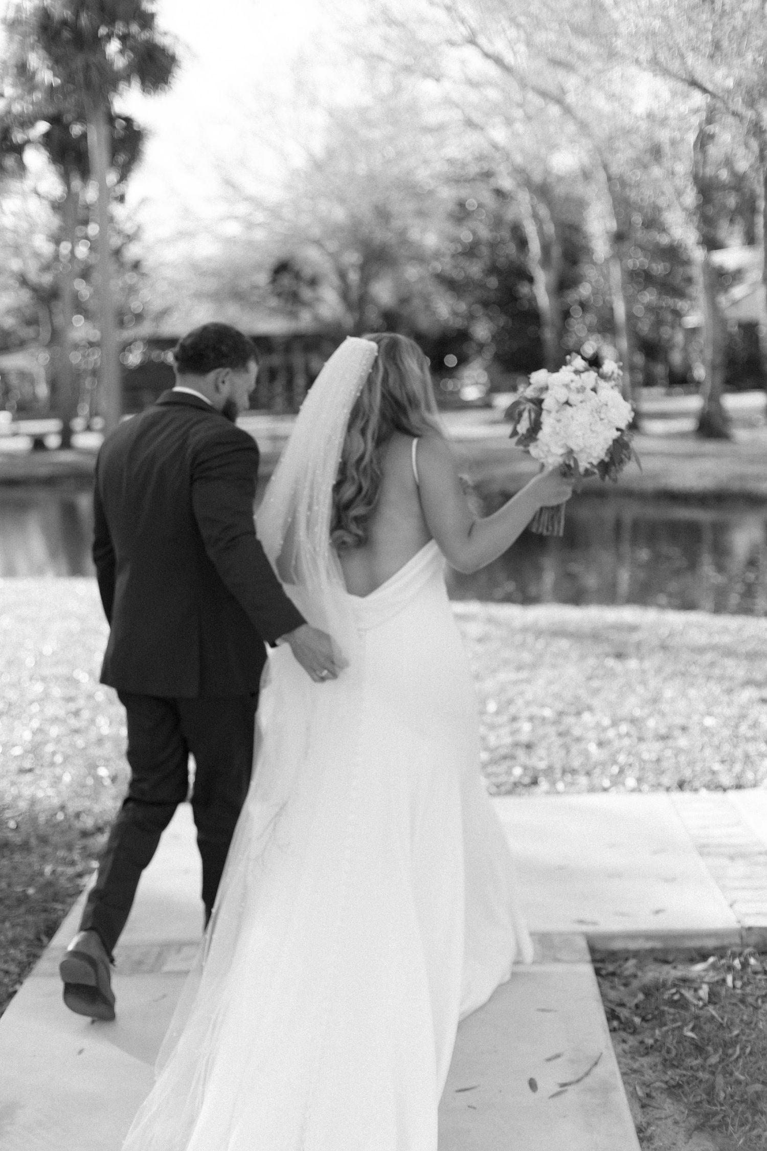 Intimate wedding ceremony moment captured in black and white photography.