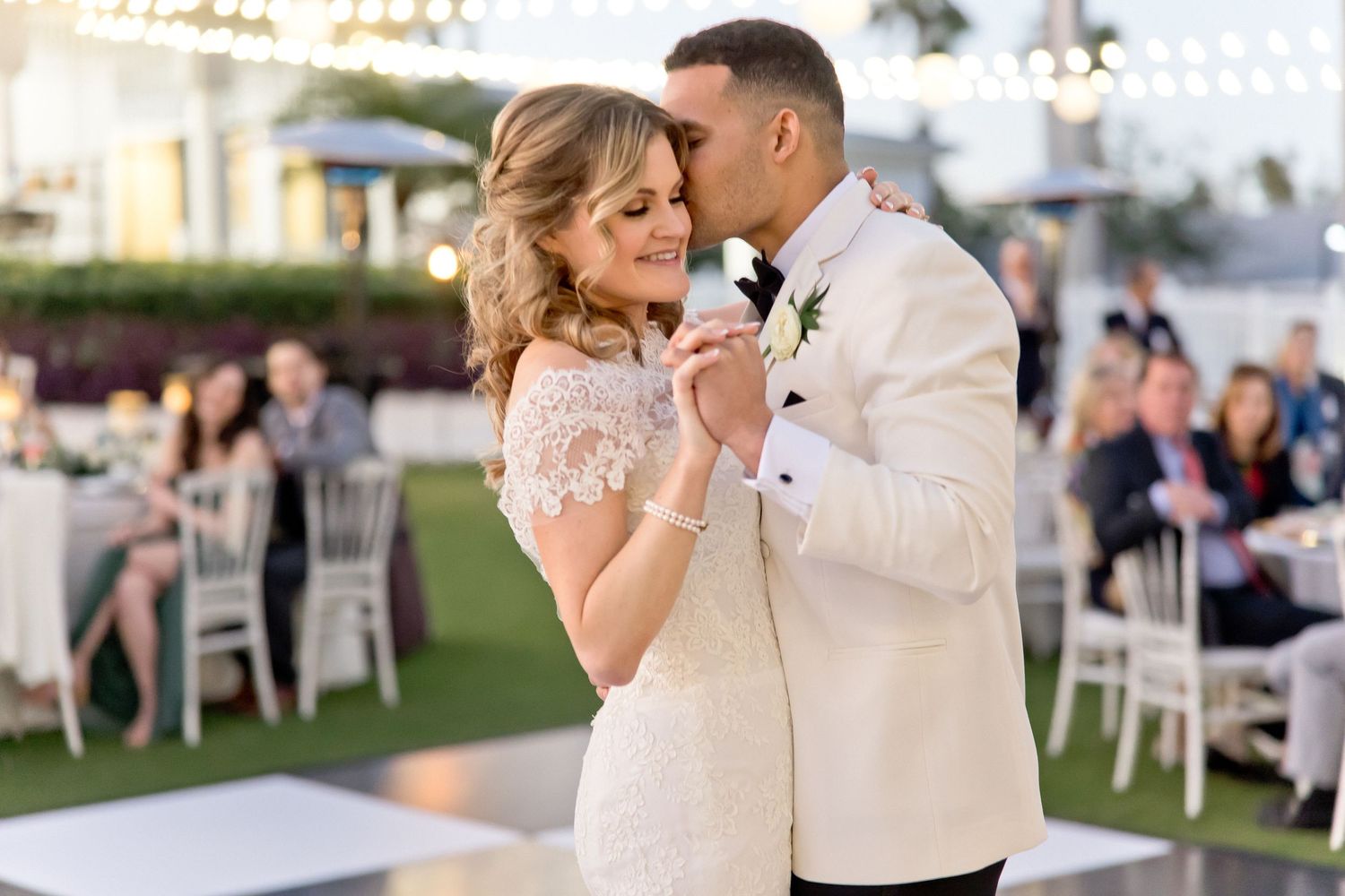 A series of romantic wedding moments captured during an outdoor celebration with string lights and palm trees.