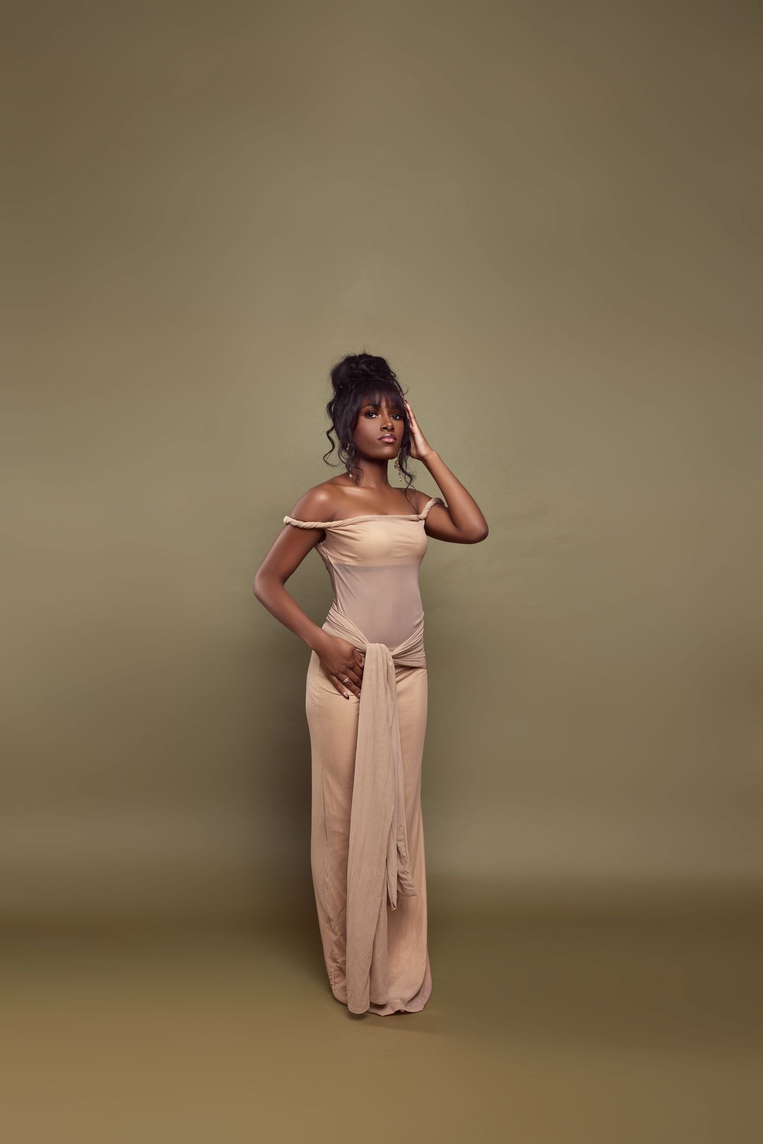 Fashion portrait series showing poses in a flowing beige dress against neutral backdrop.