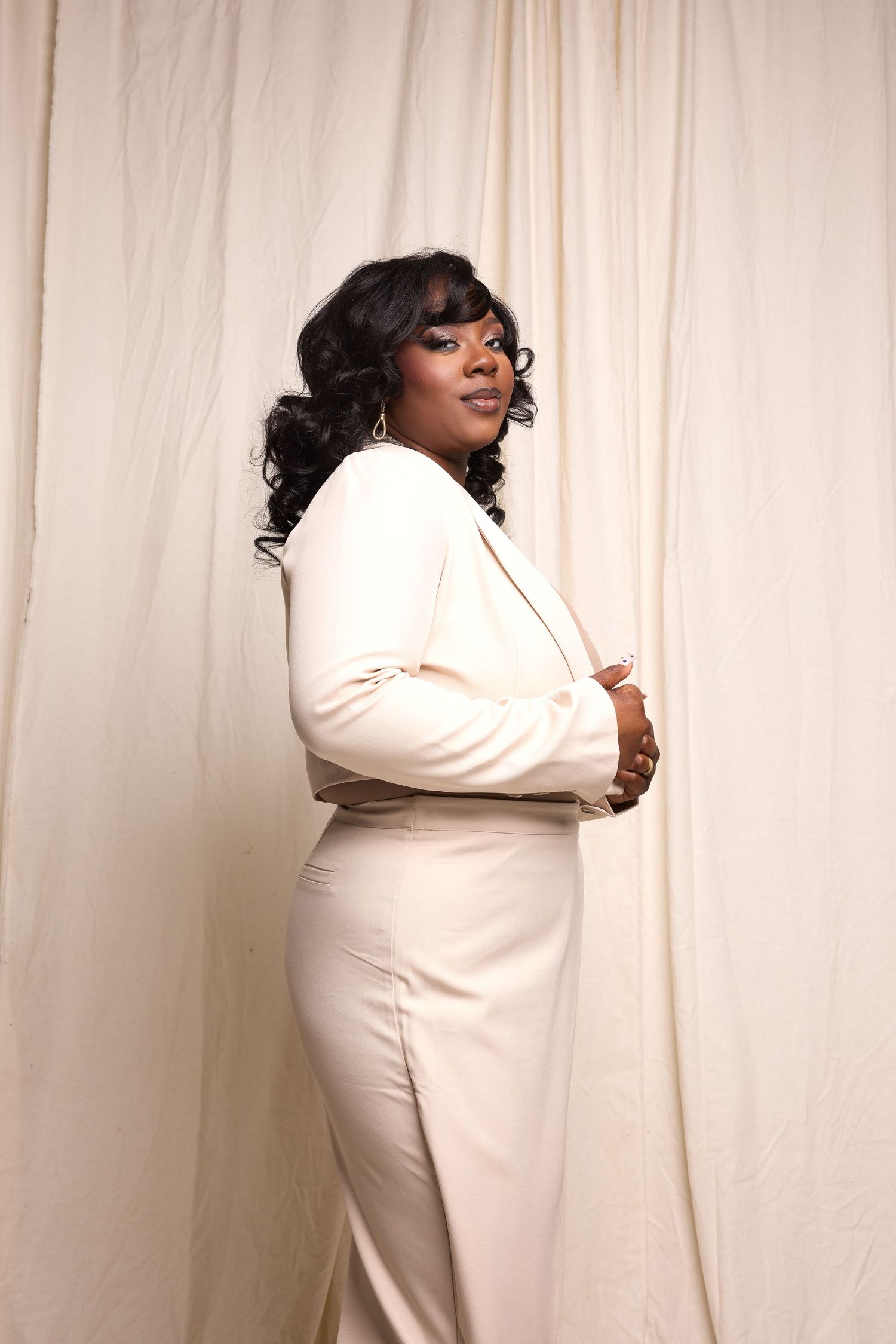 Person in white outfit poses against light backdrop in artistic photo sequence.