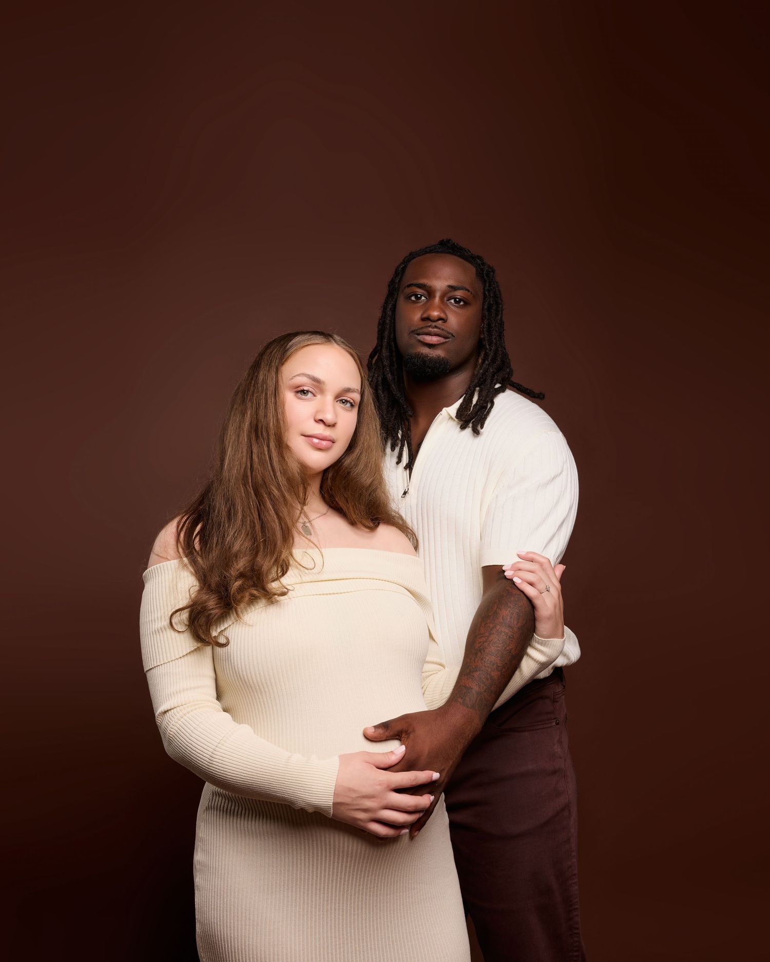 Romantic couple photography series in cream and brown tones with intimate poses.