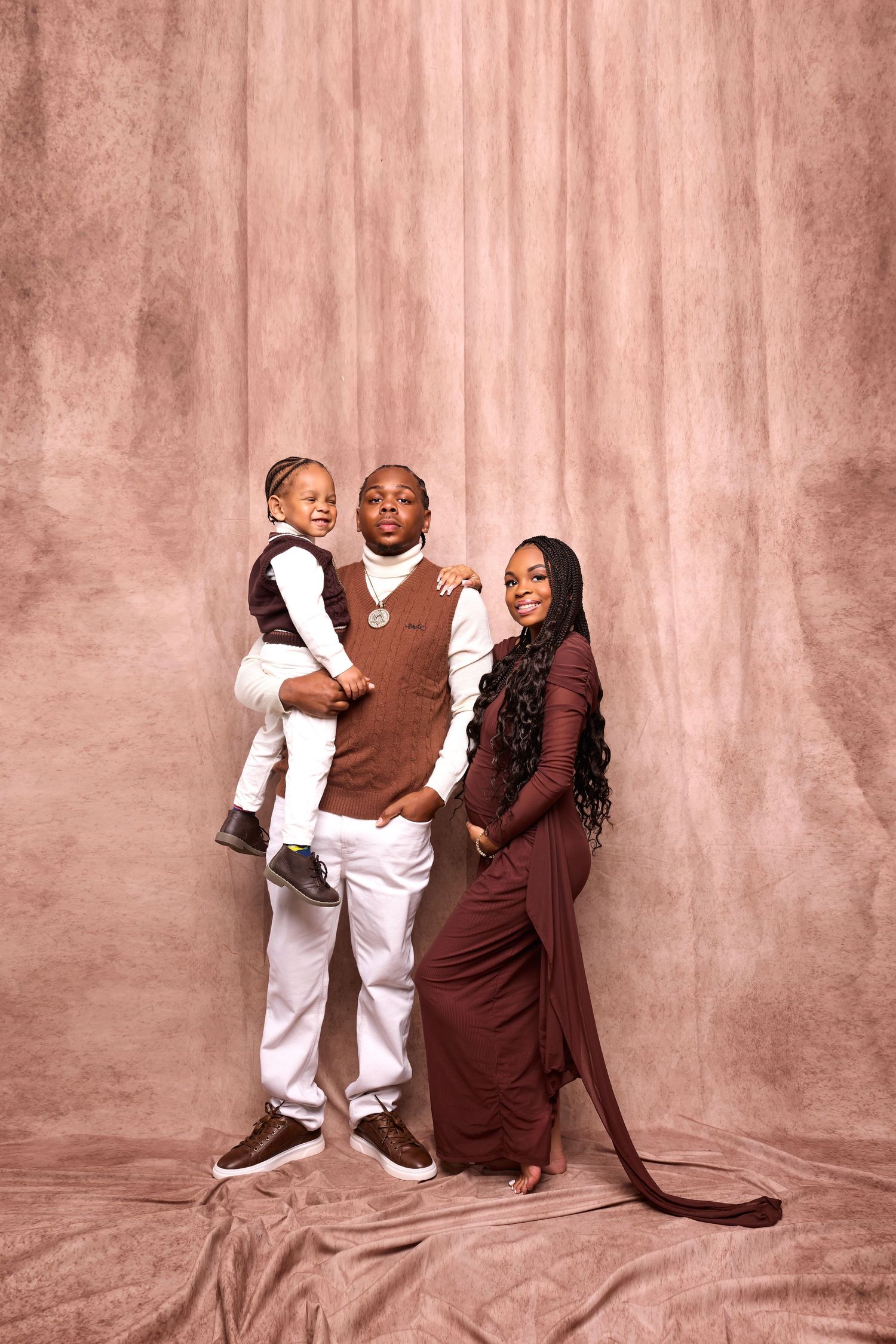 Family photo series showing playful moments against pink textured background.