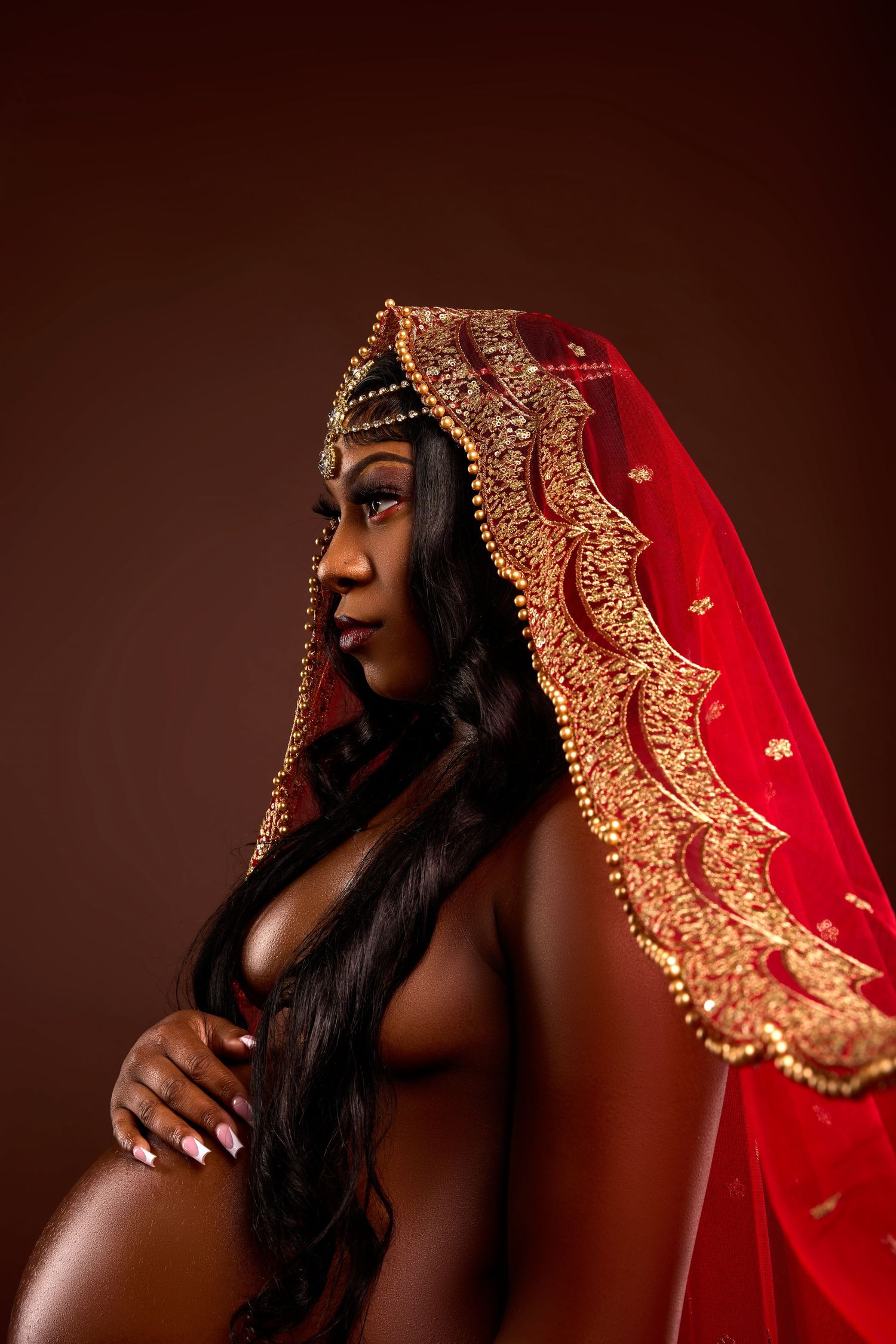 Artistic portrait series featuring traditional red and gold Indian bridal veil against dark background.