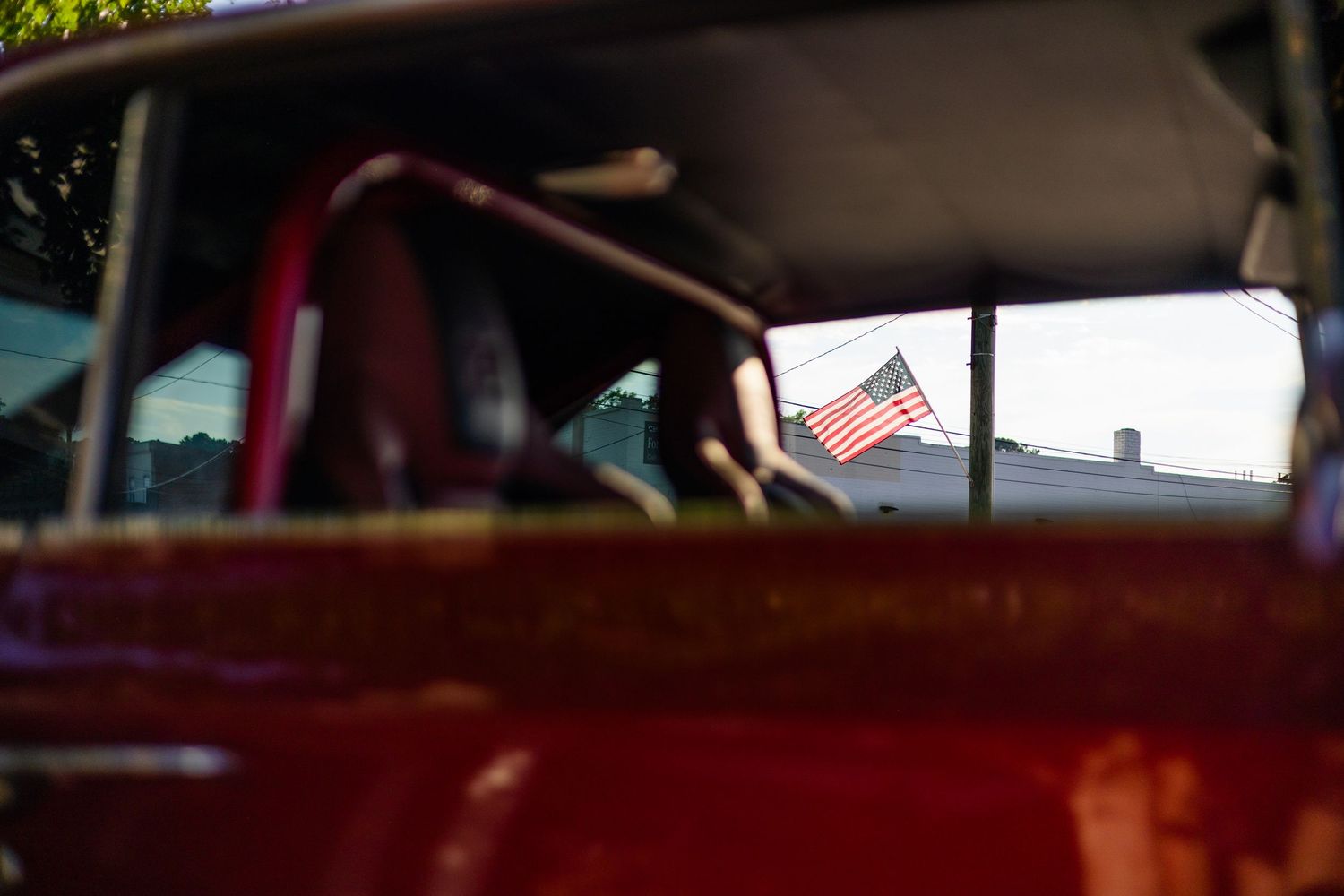 Interior view of a classic car dashboard and steering wheel.