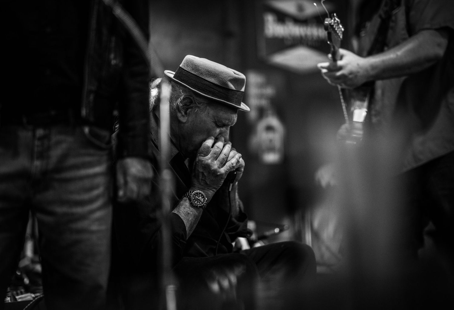 Dark moody concert photography showing musical instruments.