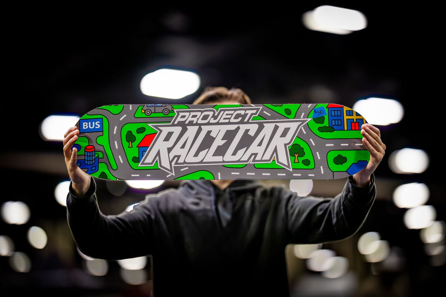 Green and white skateboard design with text reading 'Razzcar'.