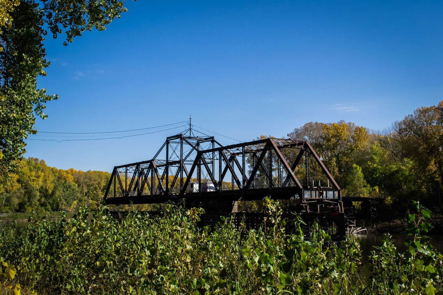 Photo of a railroad bridge over a river.