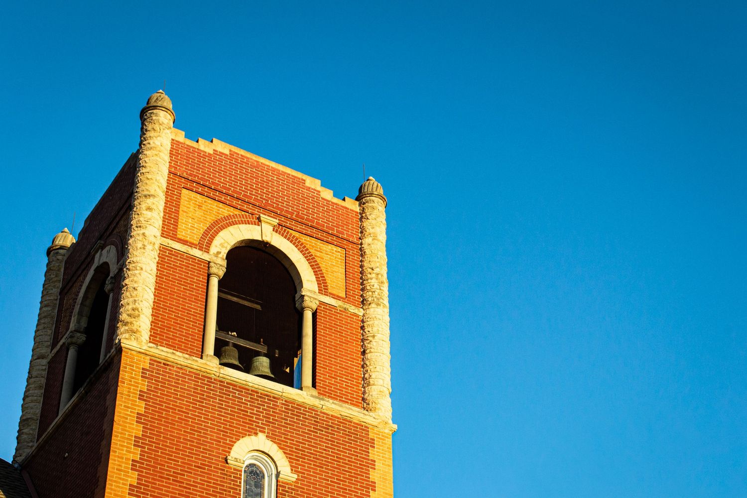 Photo of a bell tower of a church against the sky.