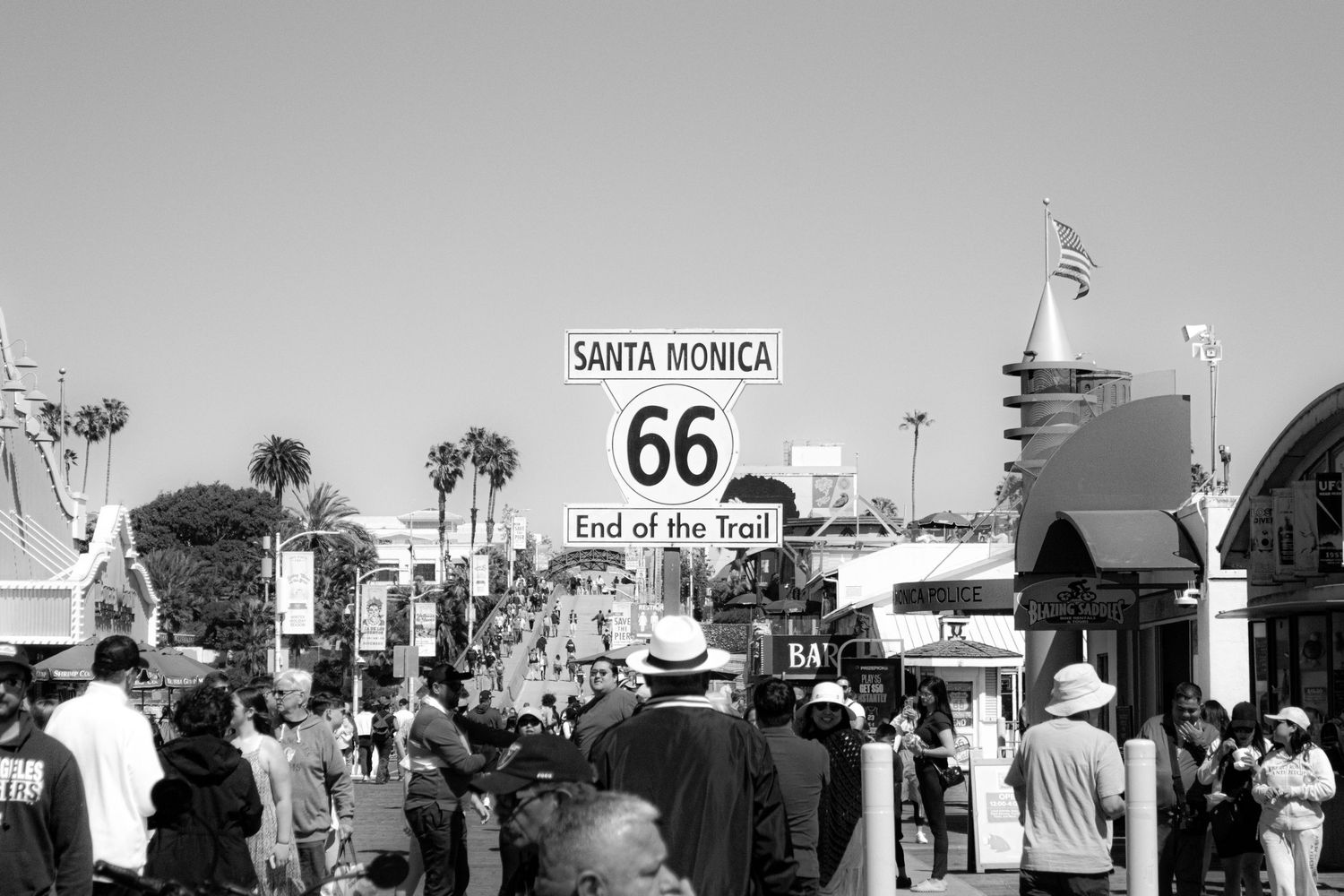 Photo of a sign on Santa Monica Pier in black and white.
