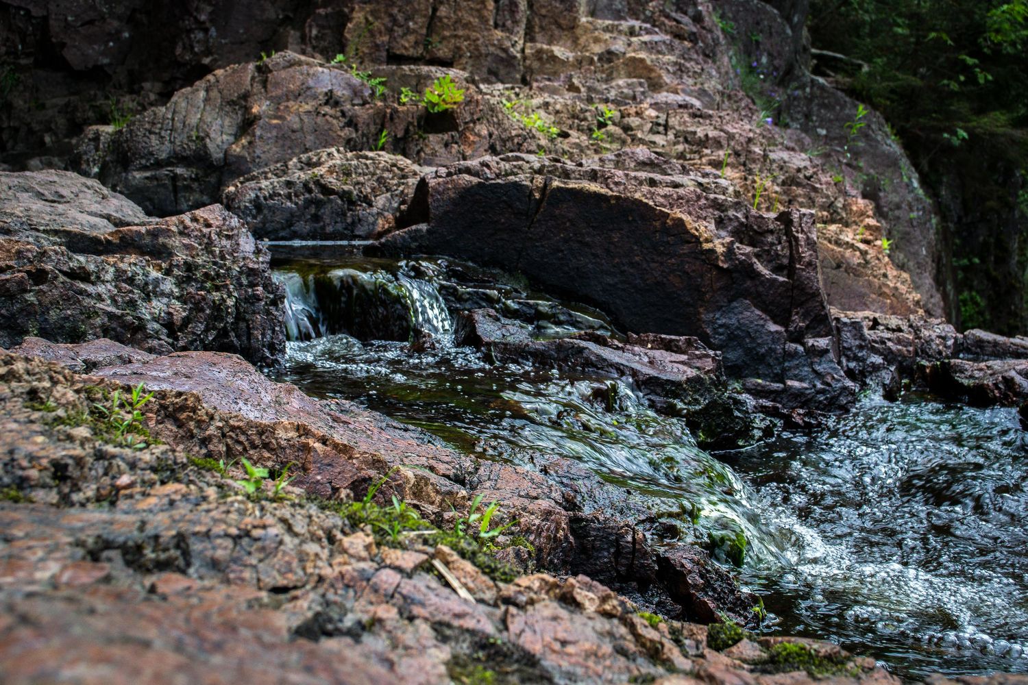 Photo of a small stream over rocks.