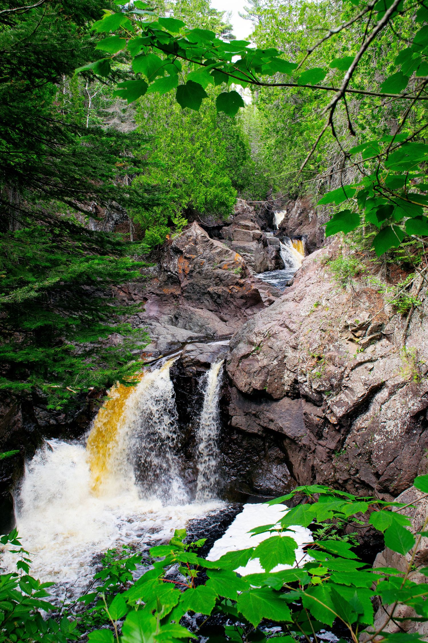 Photo of water cascading in waterfalls.