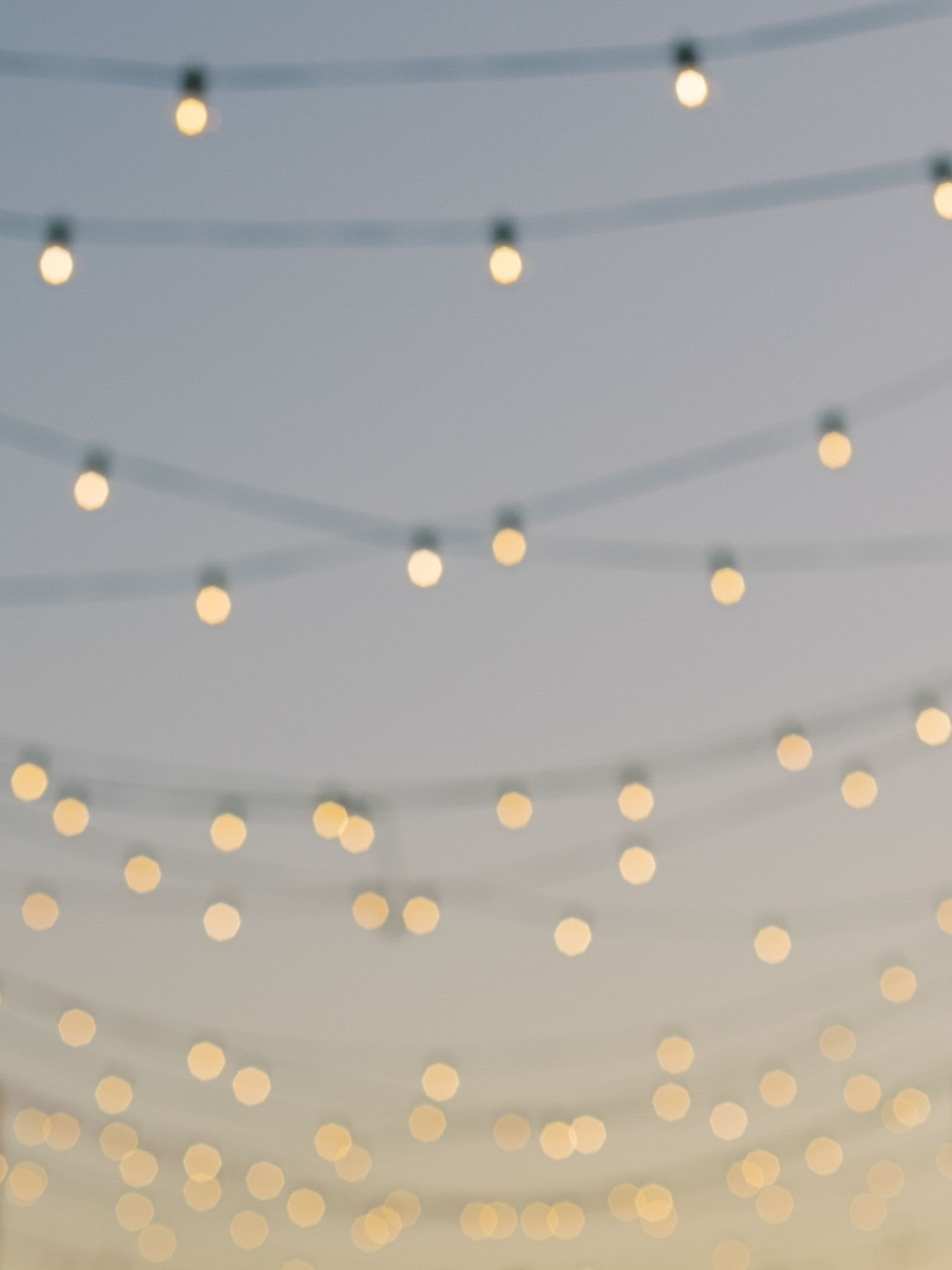 String lights create a magical ambiance against a dusky blue sky at Stanly Ranch in Napa.