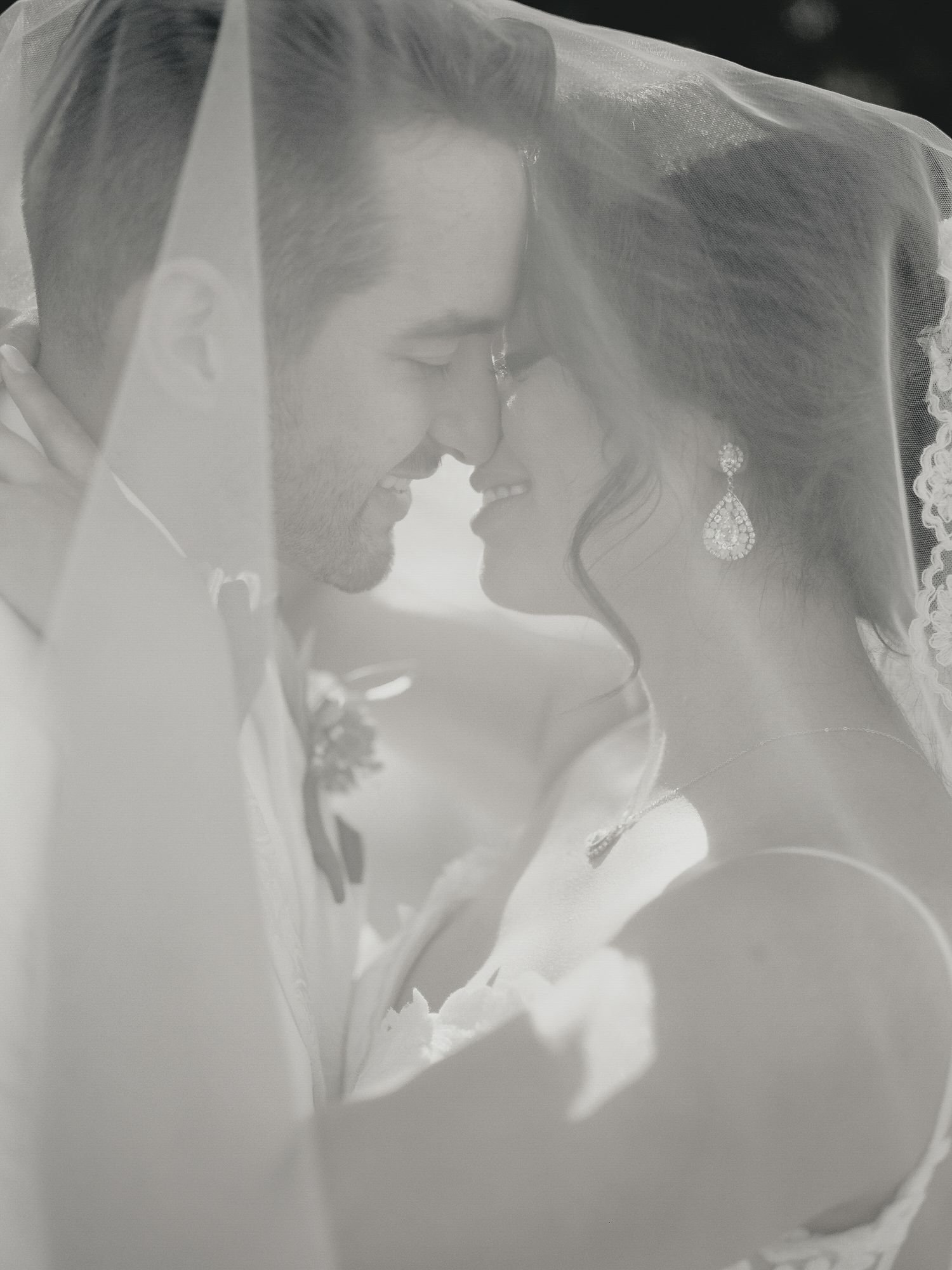 Romantic black and white portrait under a sheer veil in Napa.