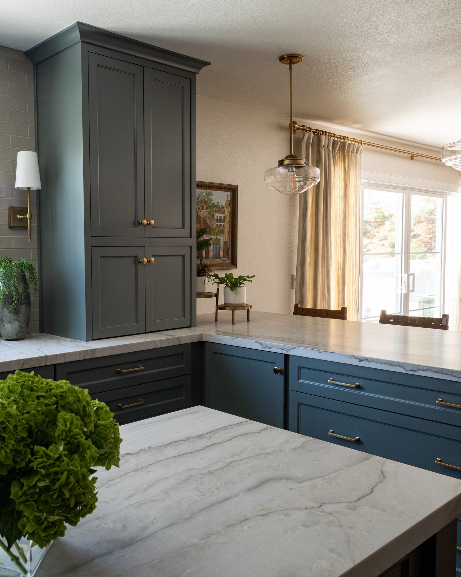 Traditional kitchen in La Habra designed by Cait Sourapas Interiors with blue cabinetry professionally photographed by Kristen Cox