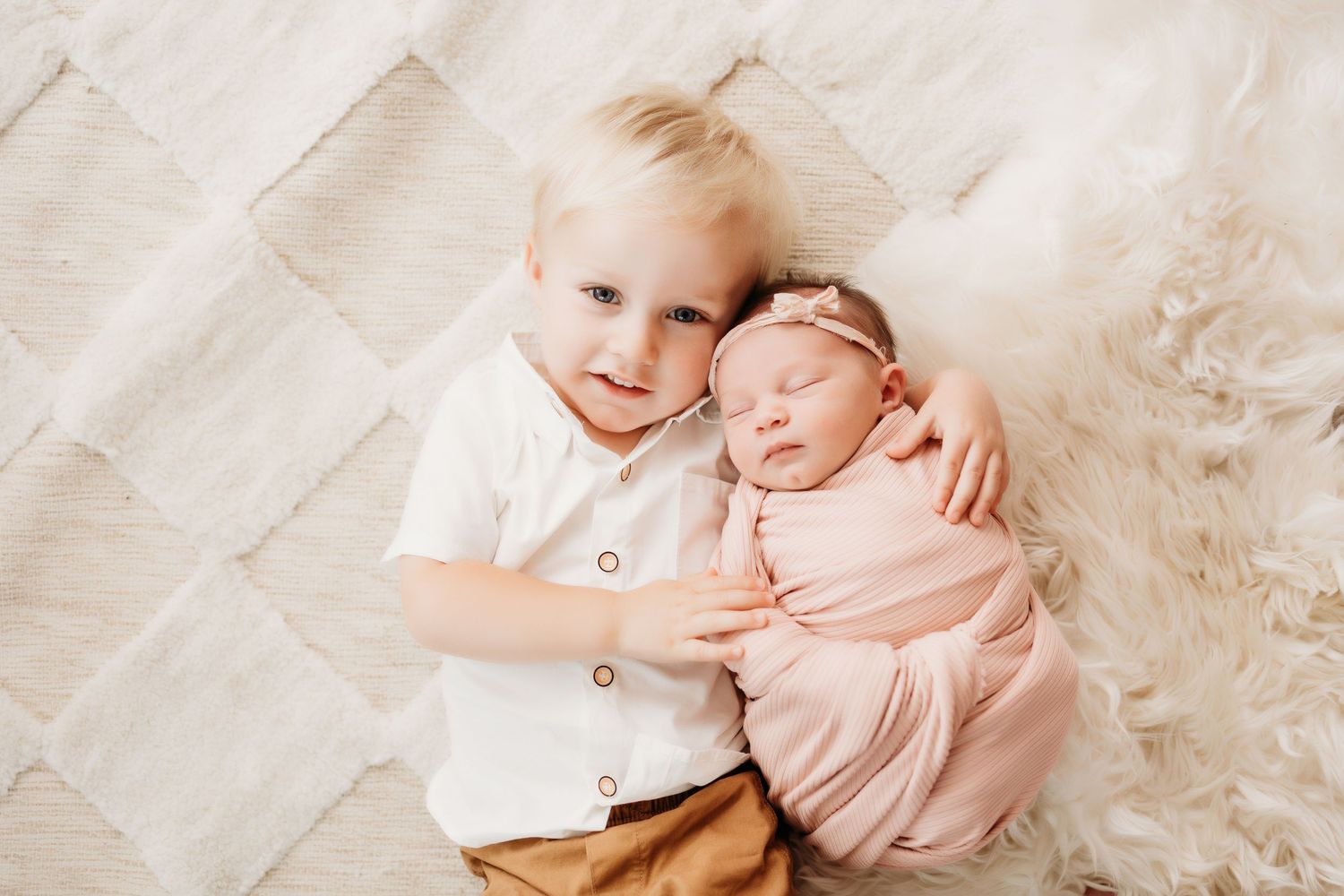 brother and baby sister newborn photography session