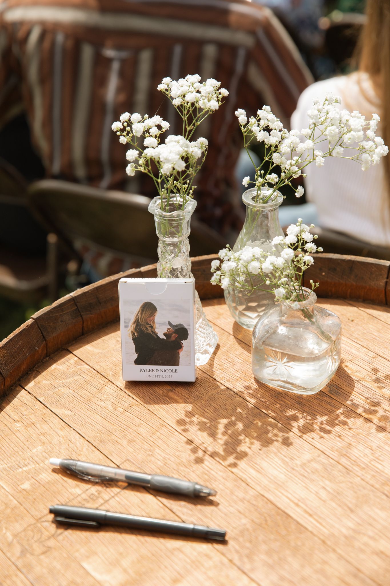 Welcome table at a beautiful, bright, outdoor wedding.